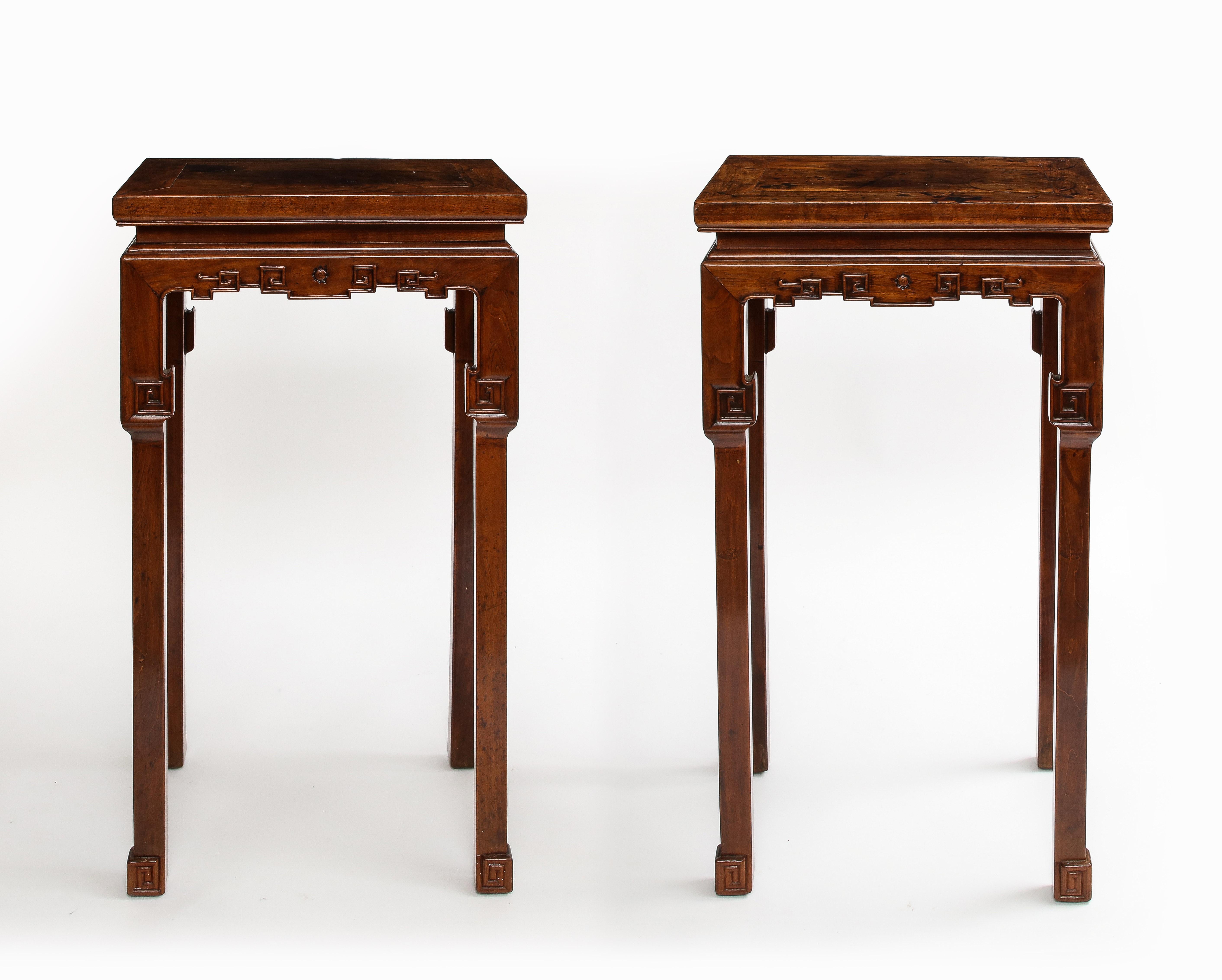 A Wonderful Pair of 19th Century Qing Dynasty Chinese Carved Hardwood Pedestals, with Provenance from a Private Collection in Texas.  Possibly Huanghuali. Standing tall the pedestals exude an air of sophistication, with matching designs that