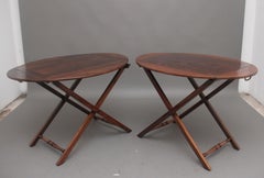 A pair of 19th Century rosewood folding butlers tray on stands