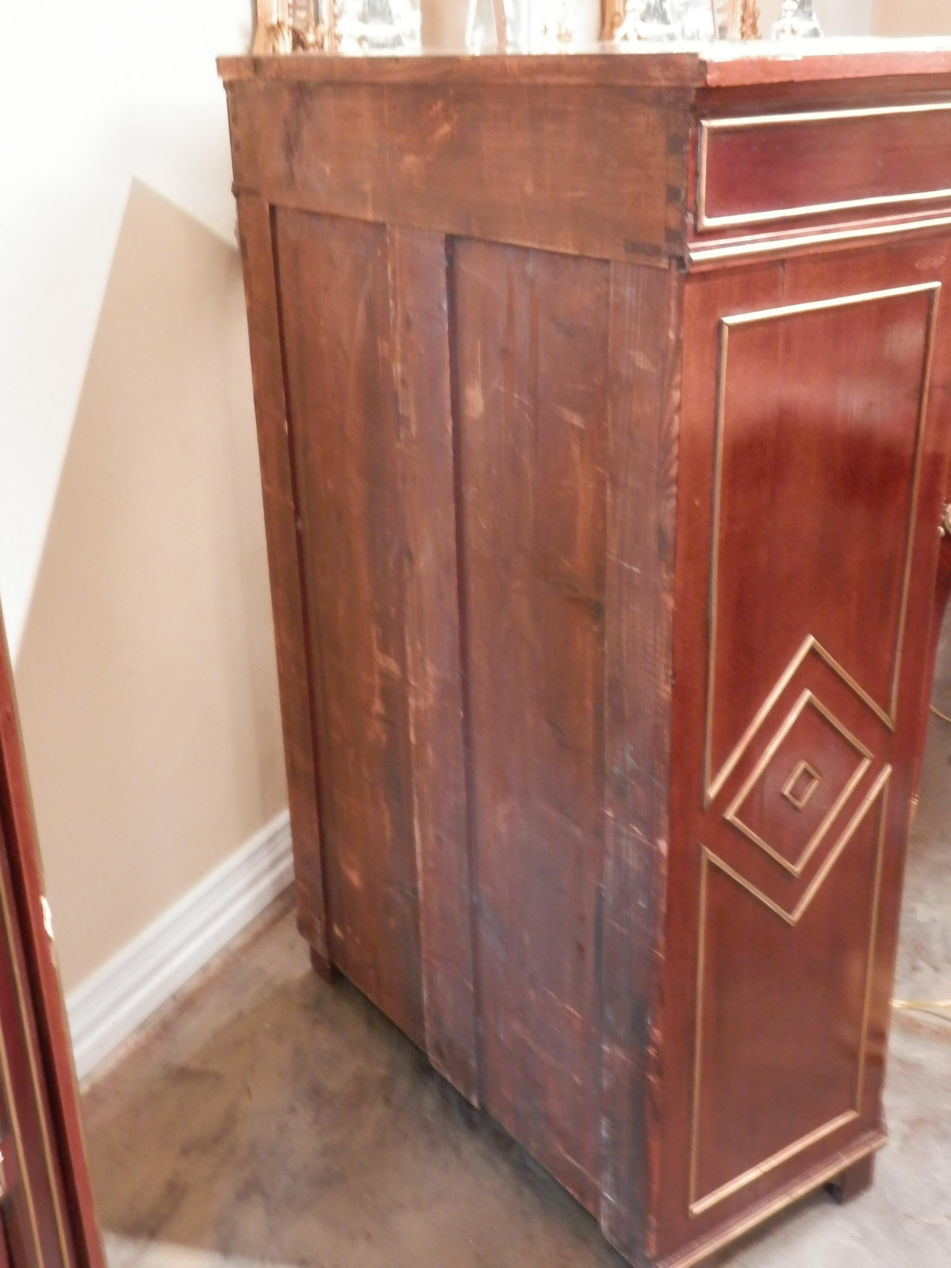 A pair of late 19th century Russian neoclassical mahogany and brass inlayed matching viewing cabinets or bookcases
Mirrored back with three shelves.