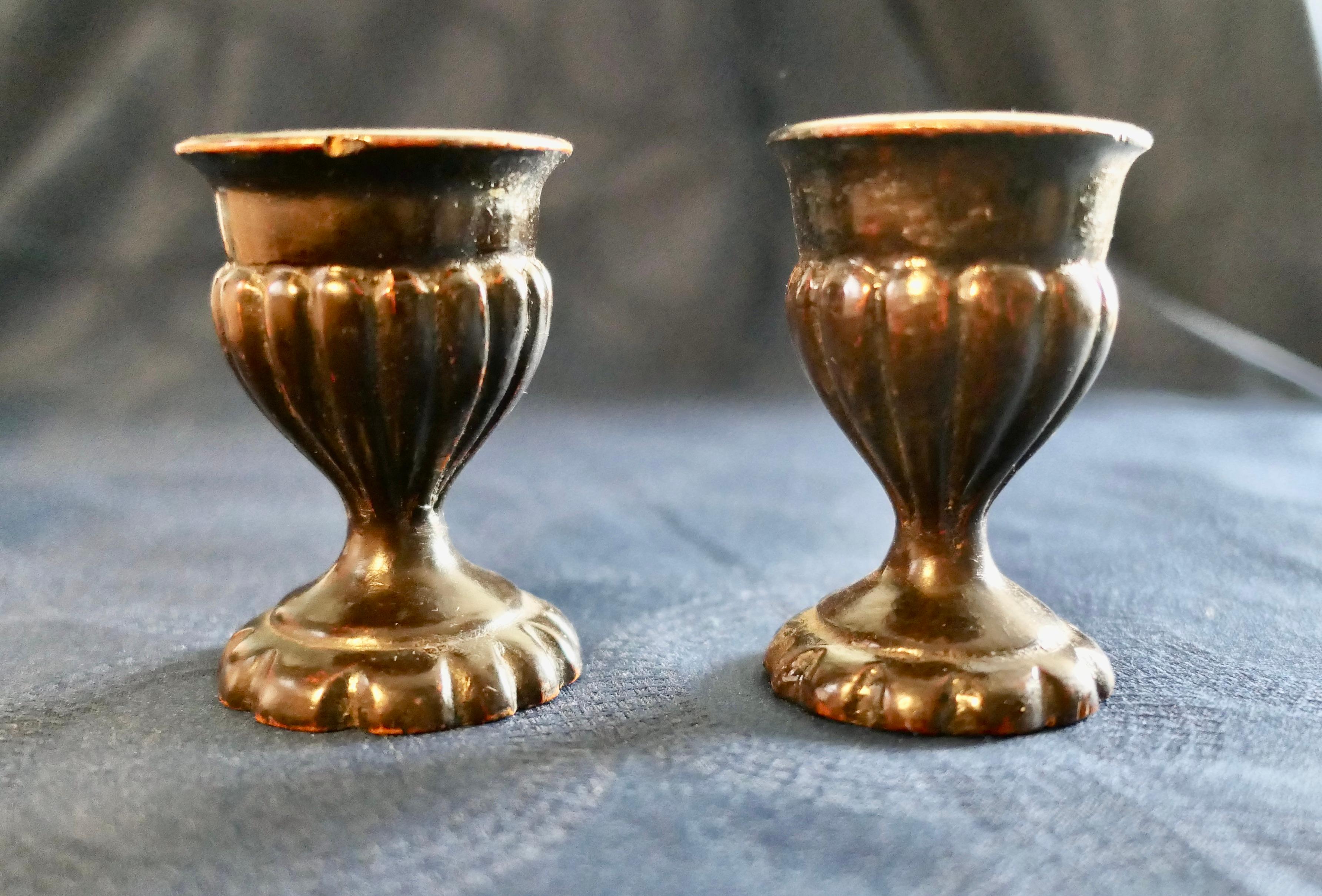 A Pair of 19th Century Treenwear Gothic Oak Eggcups  

A Very attractive hand made pair of Eggcups with fluted bowls and a scalloped base, they are in generally good condition with a few dings
The Eggcups are 3” tall and 2” in diameter
SW174