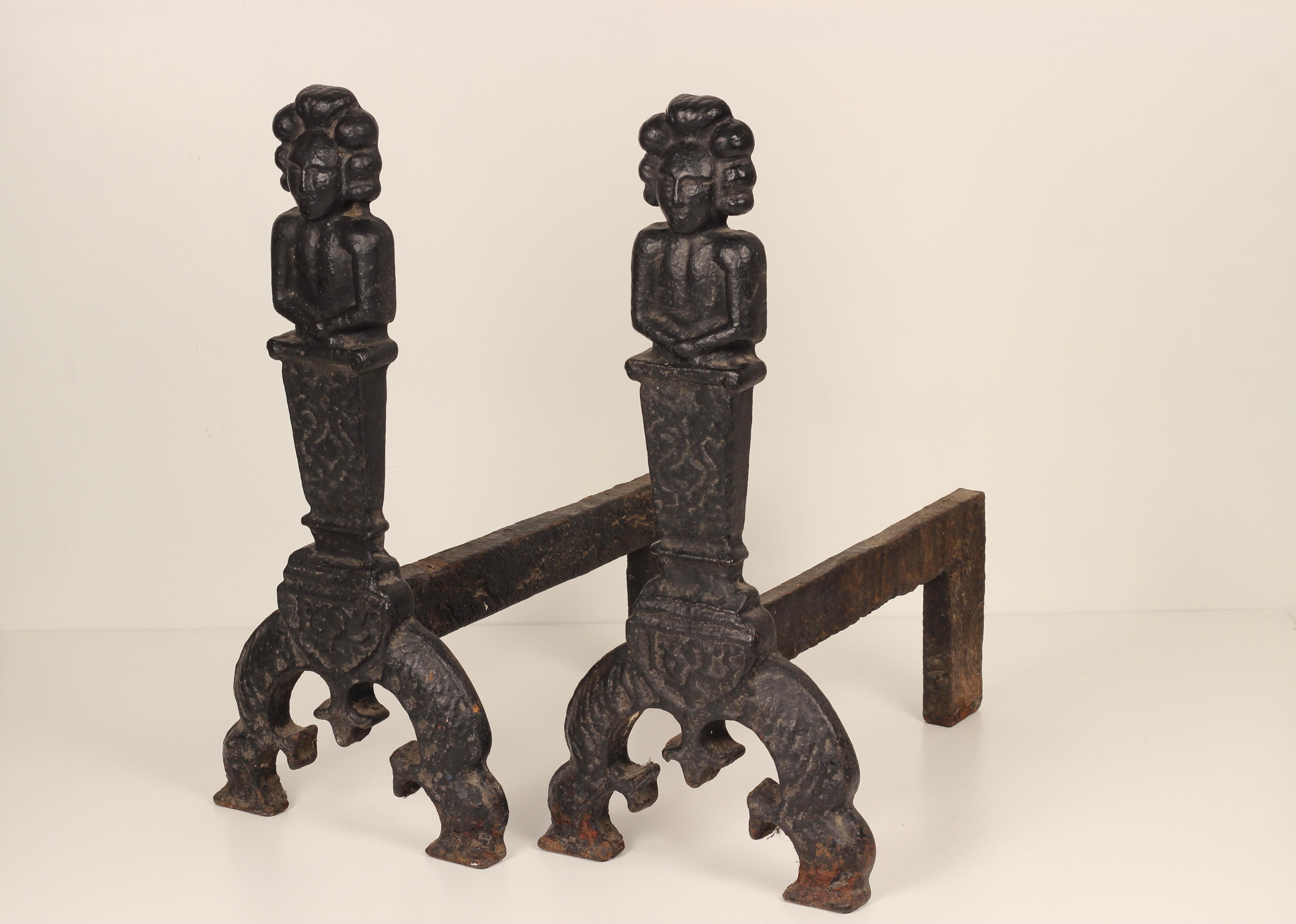 A very large and heavy set of Victorian Gothic revival Fire dogs or Andirons made from Iron. Possibly modelled on a much earlier pair. The Victorian Gothic movement or Victorian Revival movement started in England in the 1740s and gained much