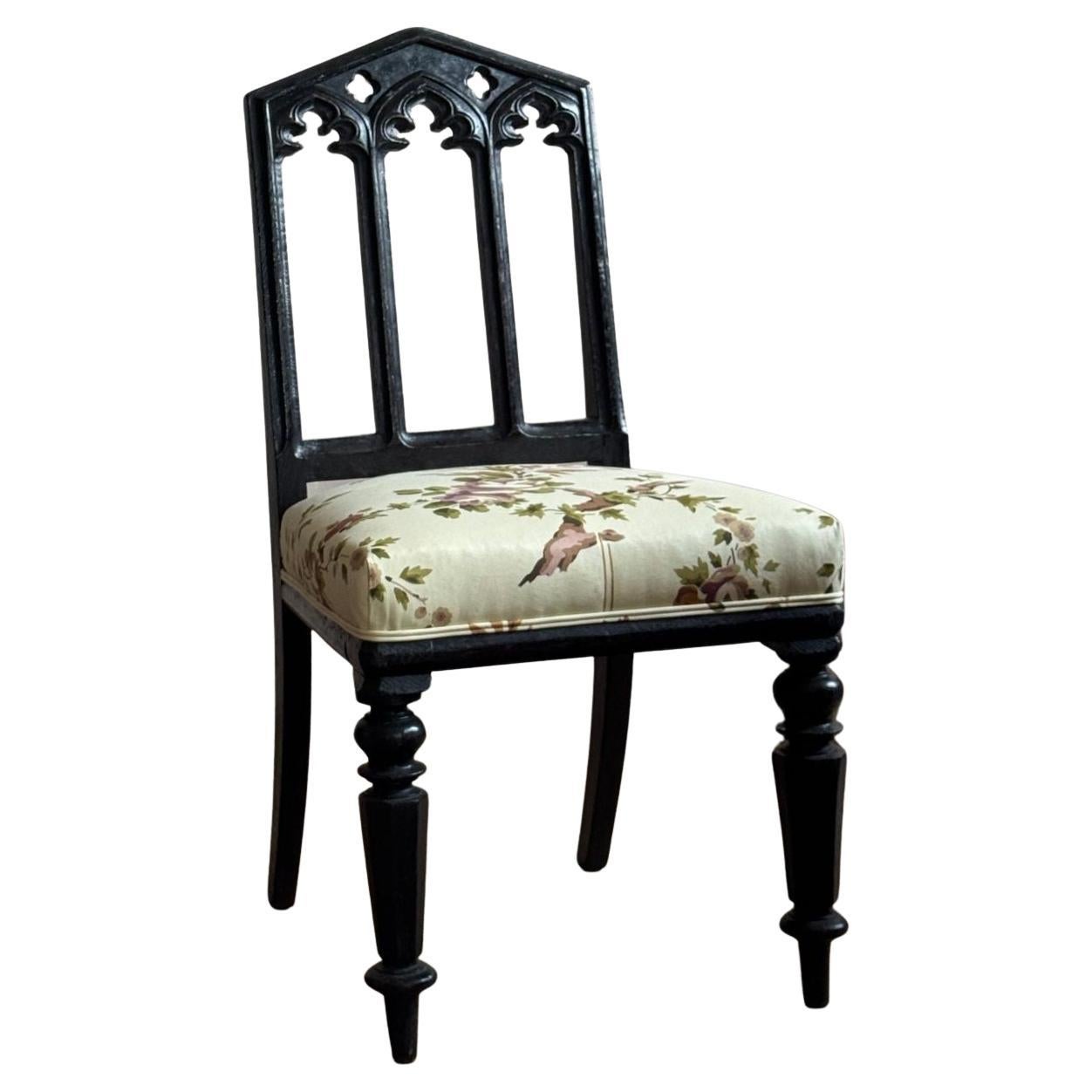 A pair of 19thC ebonised oak gothic revival chairs