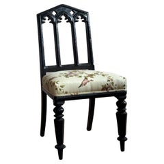 A pair of 19thC ebonised oak gothic revival chairs