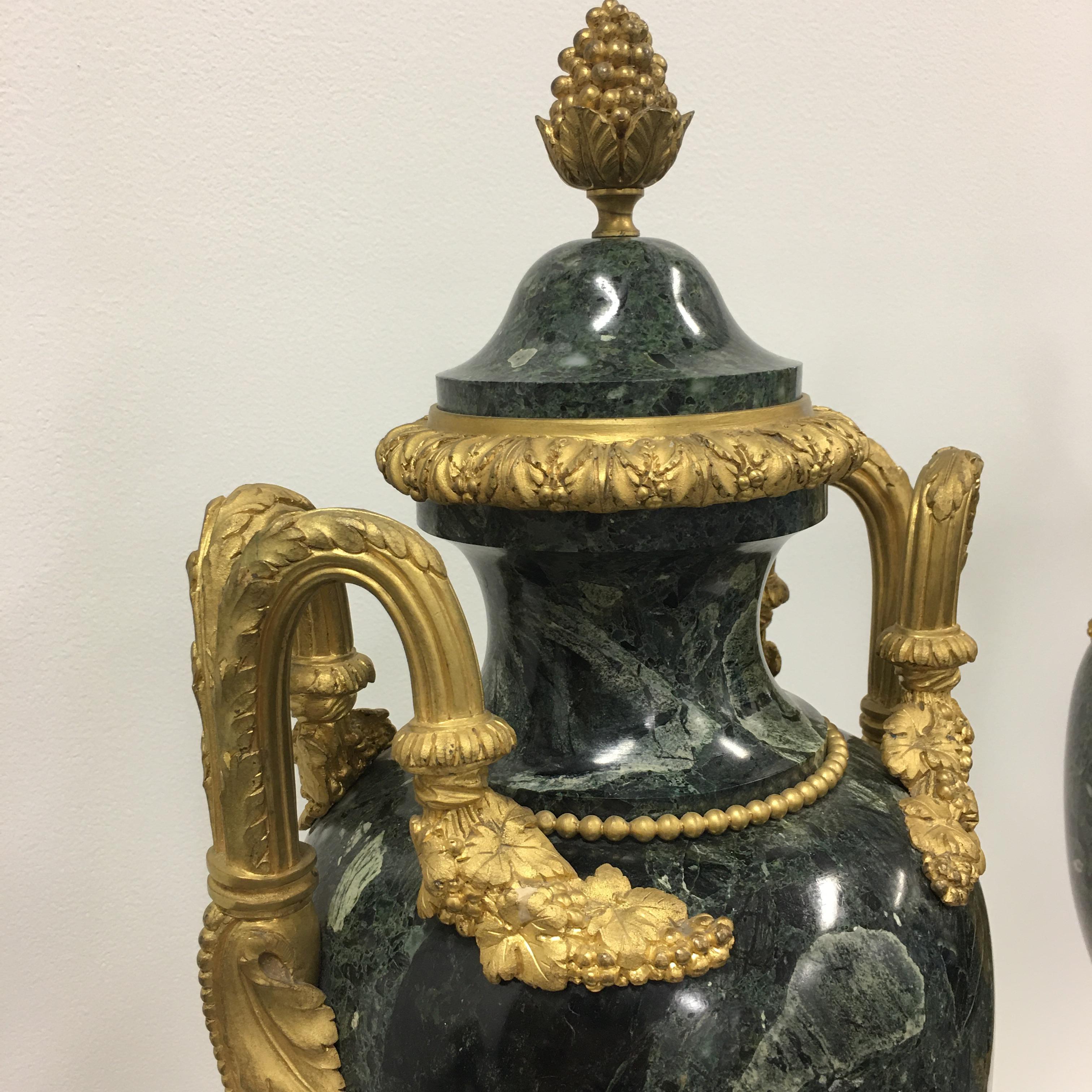 A stunning and very high quality pair of 19th. century Palace proportion Louis XVI St. Le Belle Epoque period (1871/ 80- 194 )
Vert De Patricia Marble and ormolu lidded urns. Each urn is raised by a square Vert De Patricia marble base trimmed with