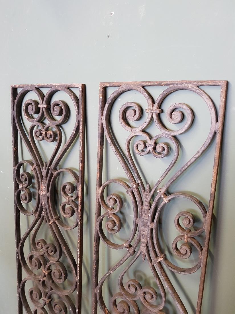 A pair of 2 identical old French cast iron door grilles decorated with various curled elements, these are both in a good but used condition. Originating from the first half of the 20th century.

The measurements are,
Depth 2 cm/ 0.7 inch.
Width