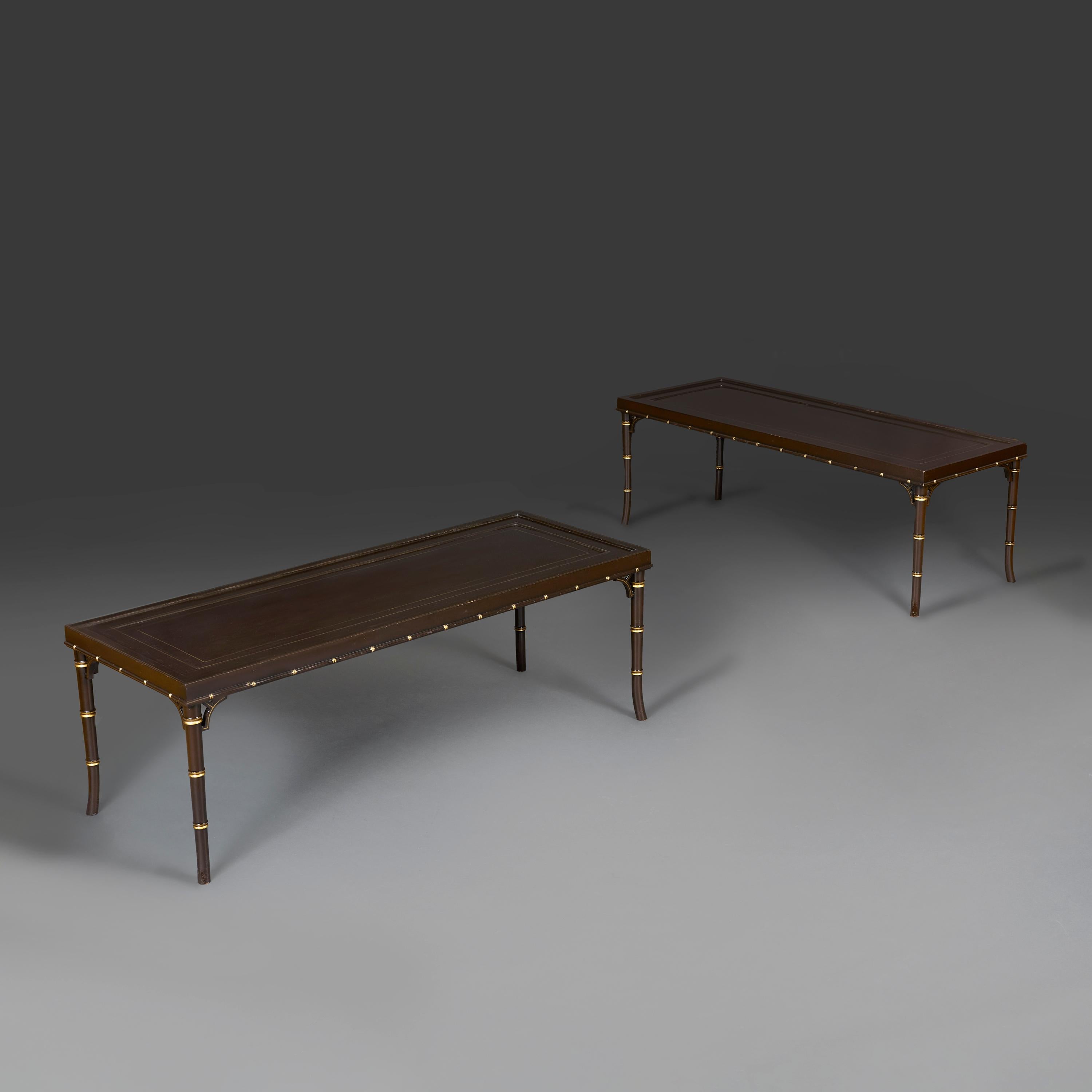 China, circa 1950.

A pair of mid-twentieth century Chinese rectangular low tables in aubergine lacquer, the glass tops supported on faux bamboo legs with gilt decorations throughout.

Height 46.00 centimetres.
Width 133.50 centimetres.
Depth 51.50