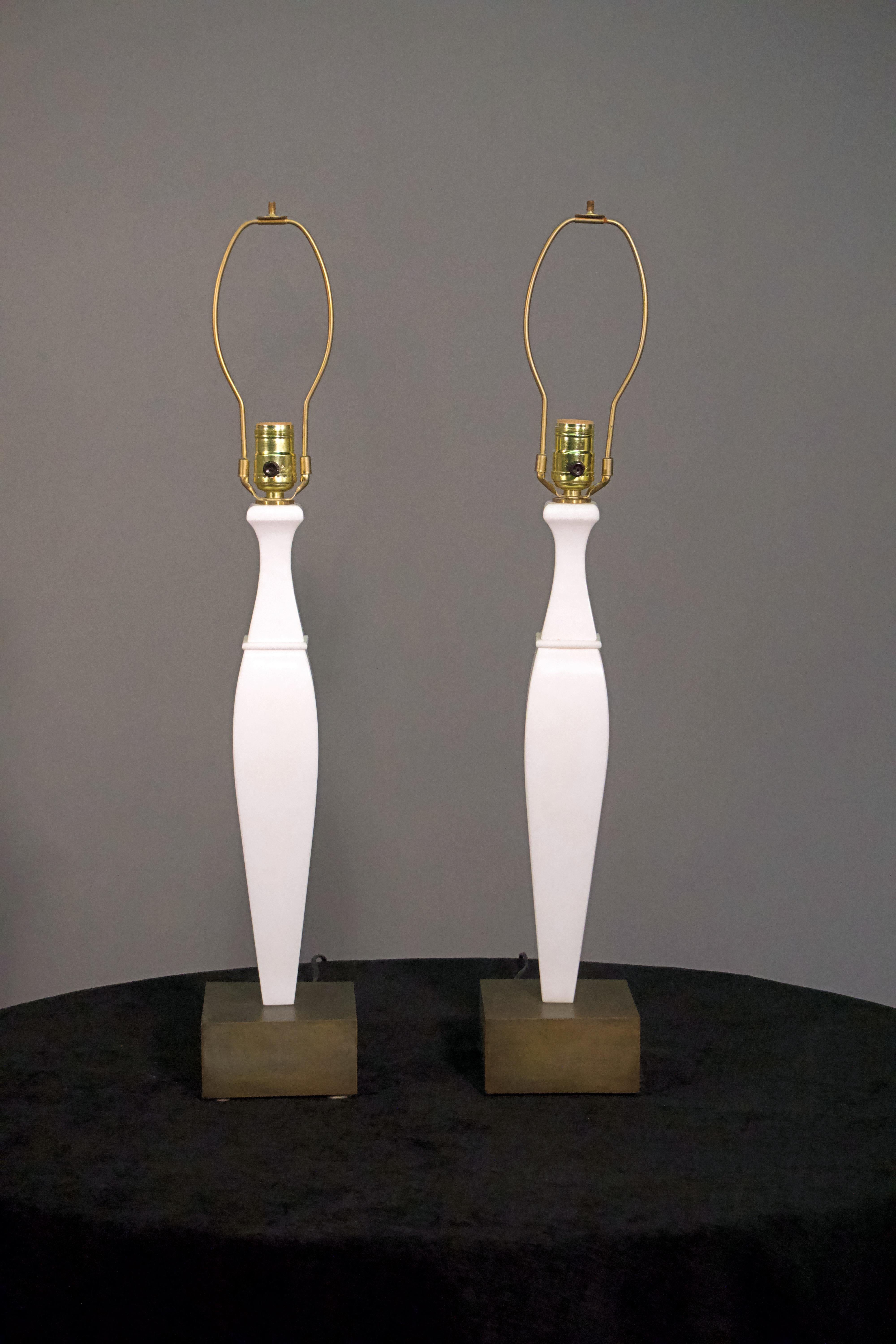 A pair of 20th century Italian white marble and bronze lamps.