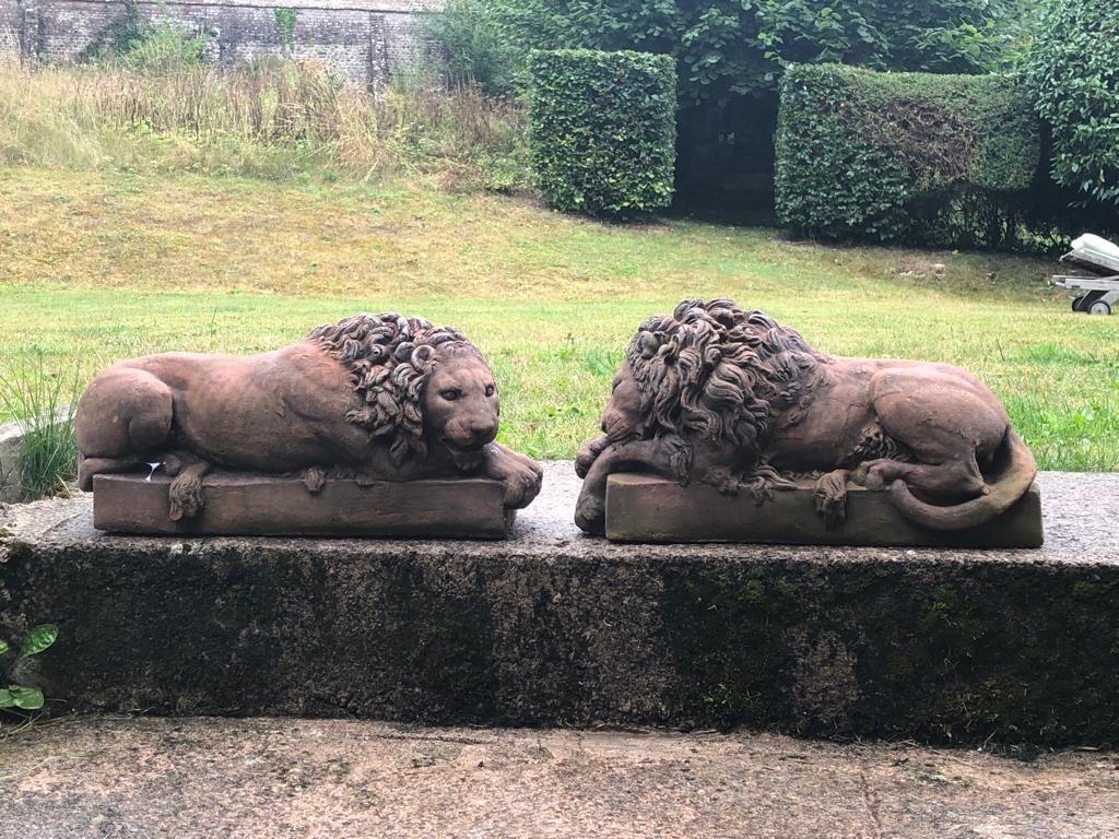 A Pair of 20th century terracotta canova lions. A beautifully modelled, 20th century pair of fired terracotta lions after Canova. English 20th century.