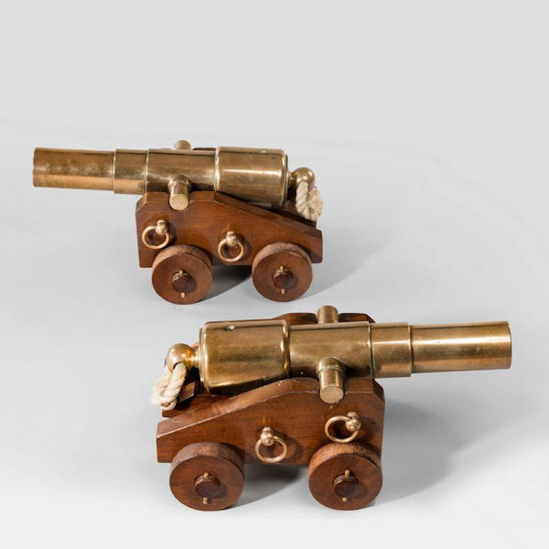 A pair of 4 stage English bronze 18'' signal cannon on walnut carriages with bronze fittings.
 