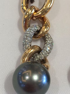 A pair of 5+ plus Tahitian dark pearl 18kt Rose gold and diamonds earring