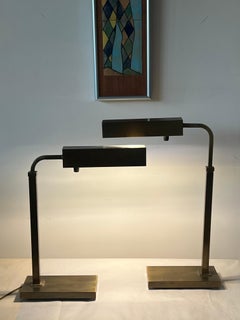 A Pair Of Adjustable Height Table Lamps In Bronze Finish Ca' 1960's