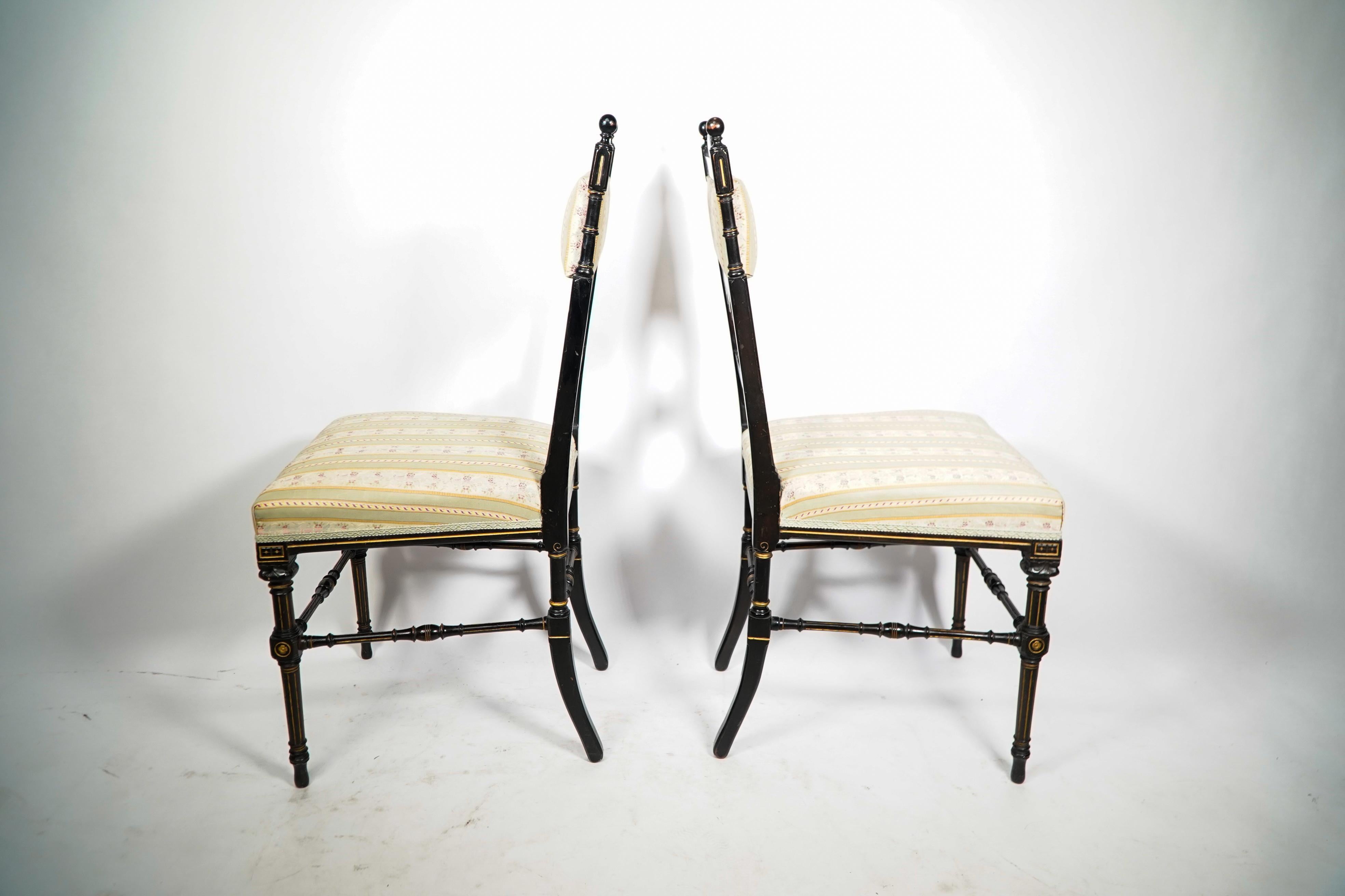 Ebonized Whytock & Reid. A pair of Aesthetic Movement ebonized & parcel gilt side chairs. For Sale