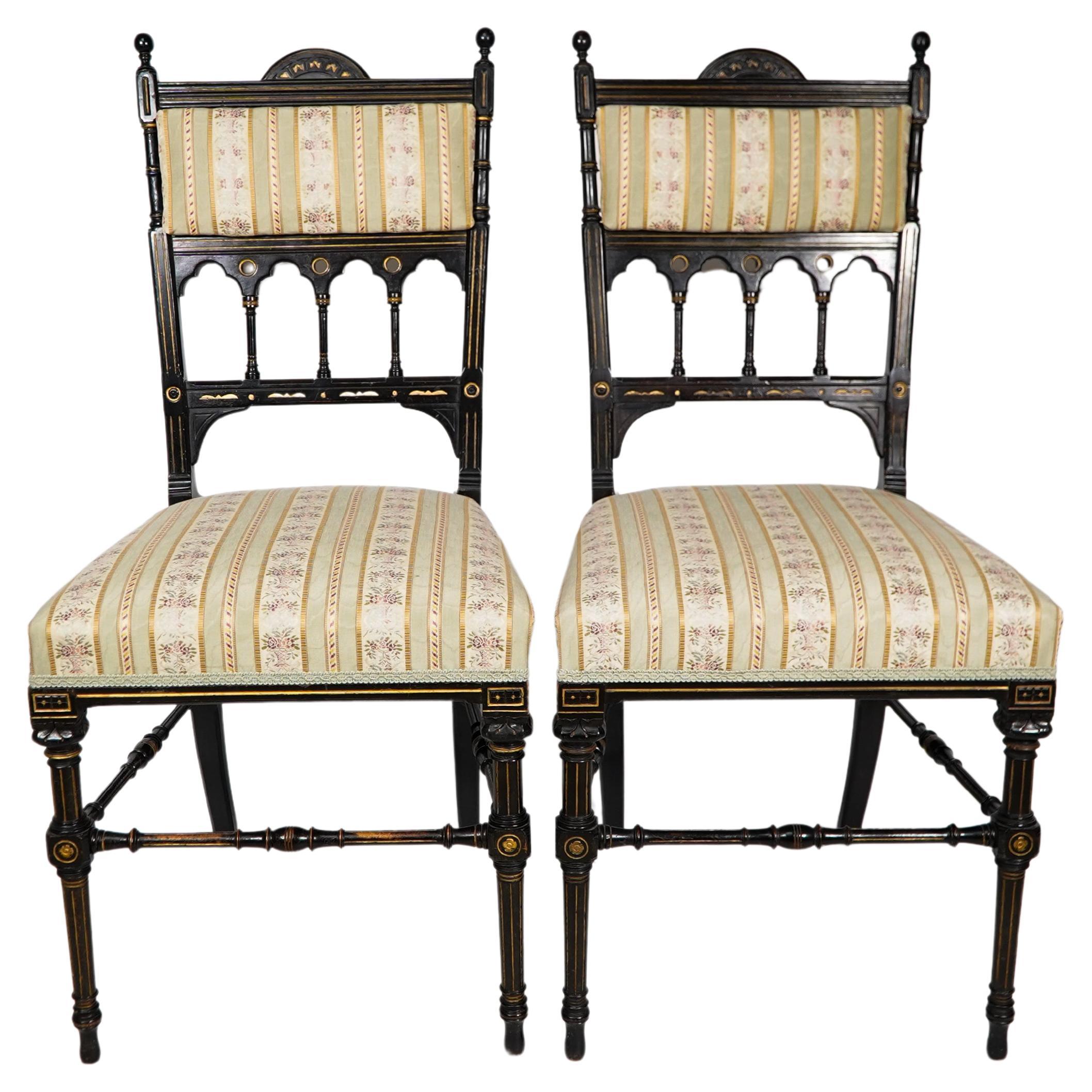 Whytock & Reid of Edinburgh. A rare pair of high Aesthetic Movement ebonized and parcel gilt side chairs. 
