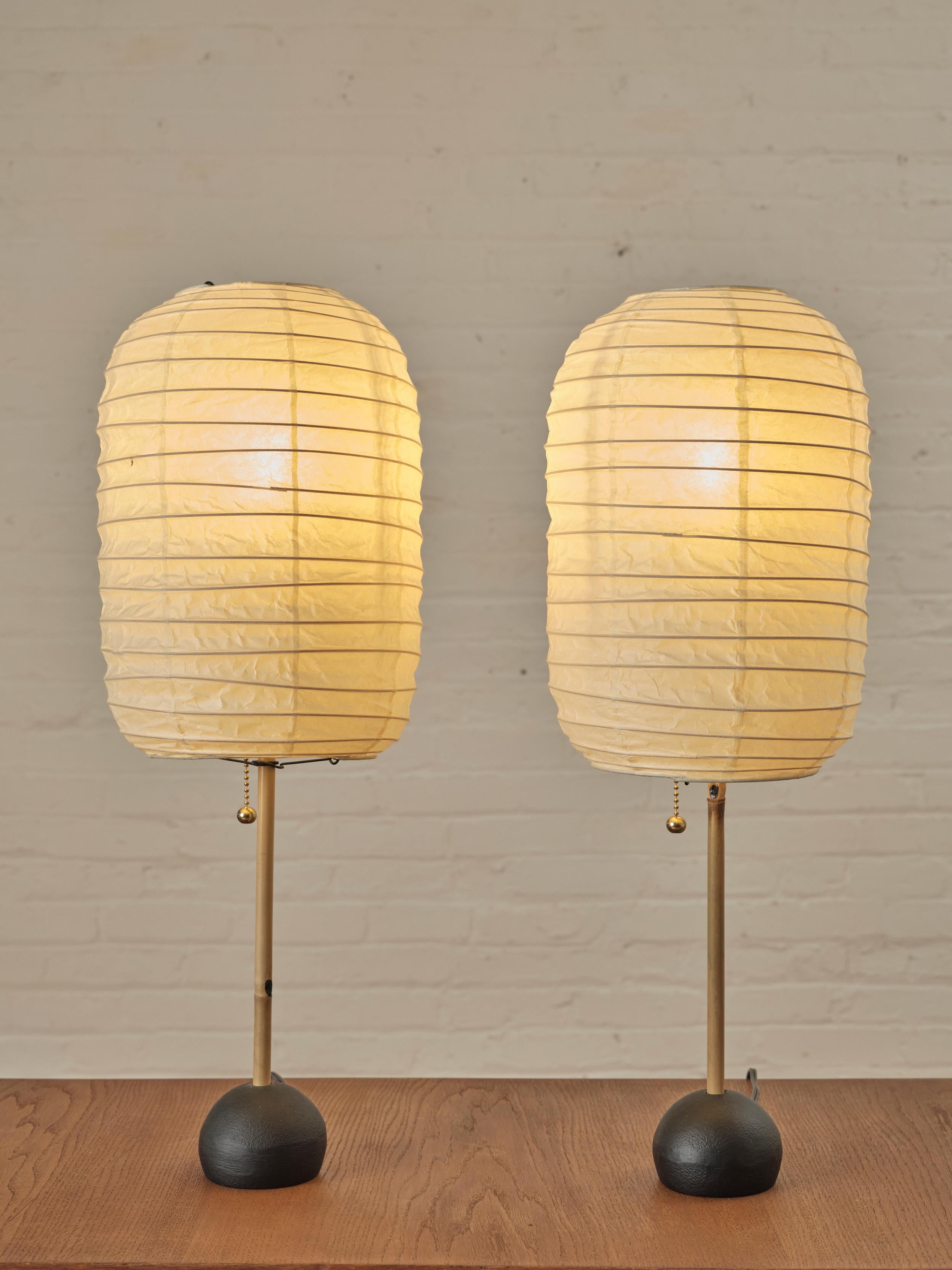 Akari BB1-30DL table lamps by Isamu Noguchi. The lamps are created from handmade washi paper and bamboo ribbing, supported by a metal frame.

About Isamu Noguchi

Isamu Noguchi (1904-1988) was a renowned Japanese-American artist and designer known
