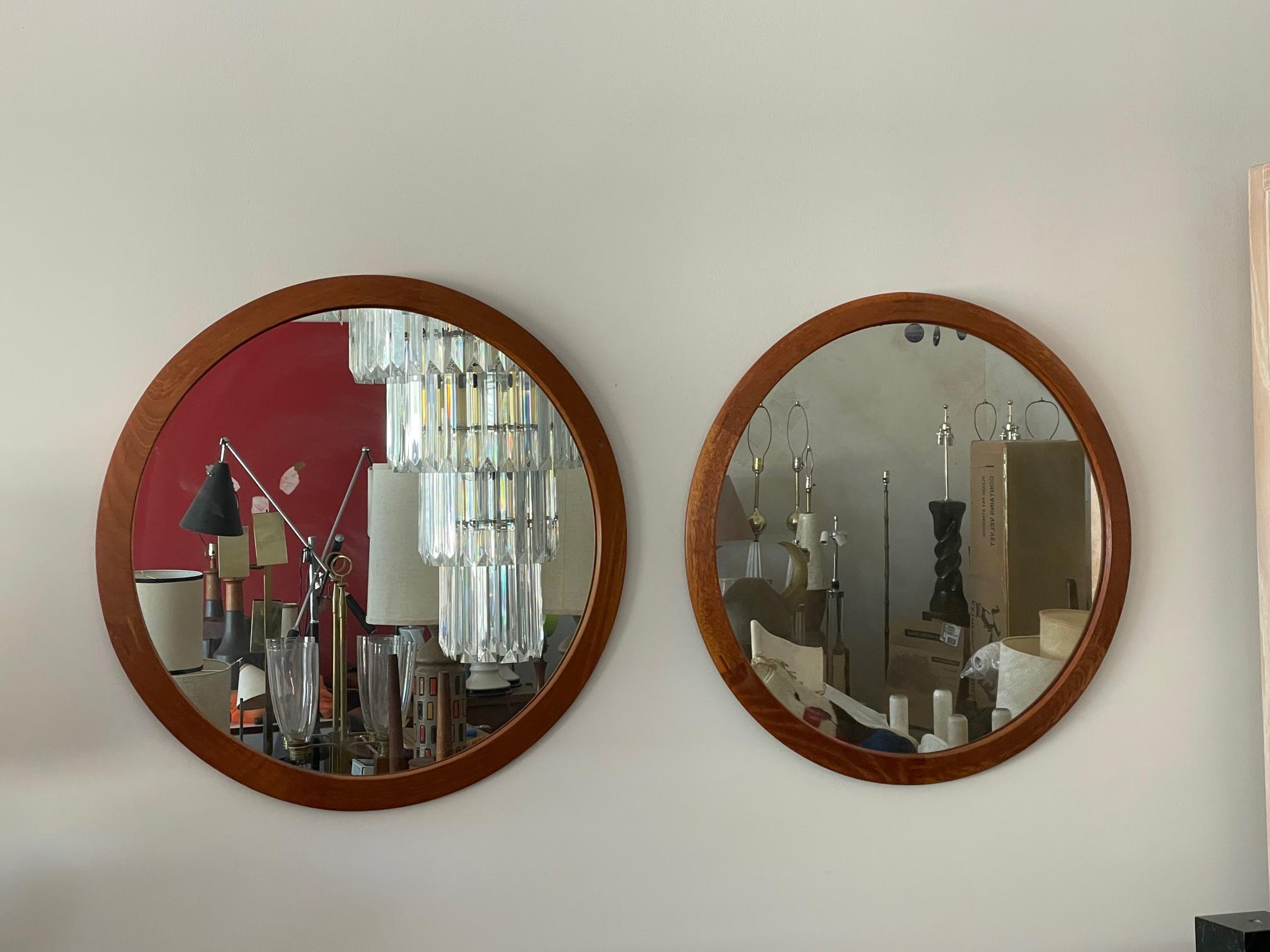 A pair of round mirrors in teak by Aksel Kjersgaard, manufactured by Odder, Denmark, ca' 1960's. Beautiful construction and decorative joinery.
  