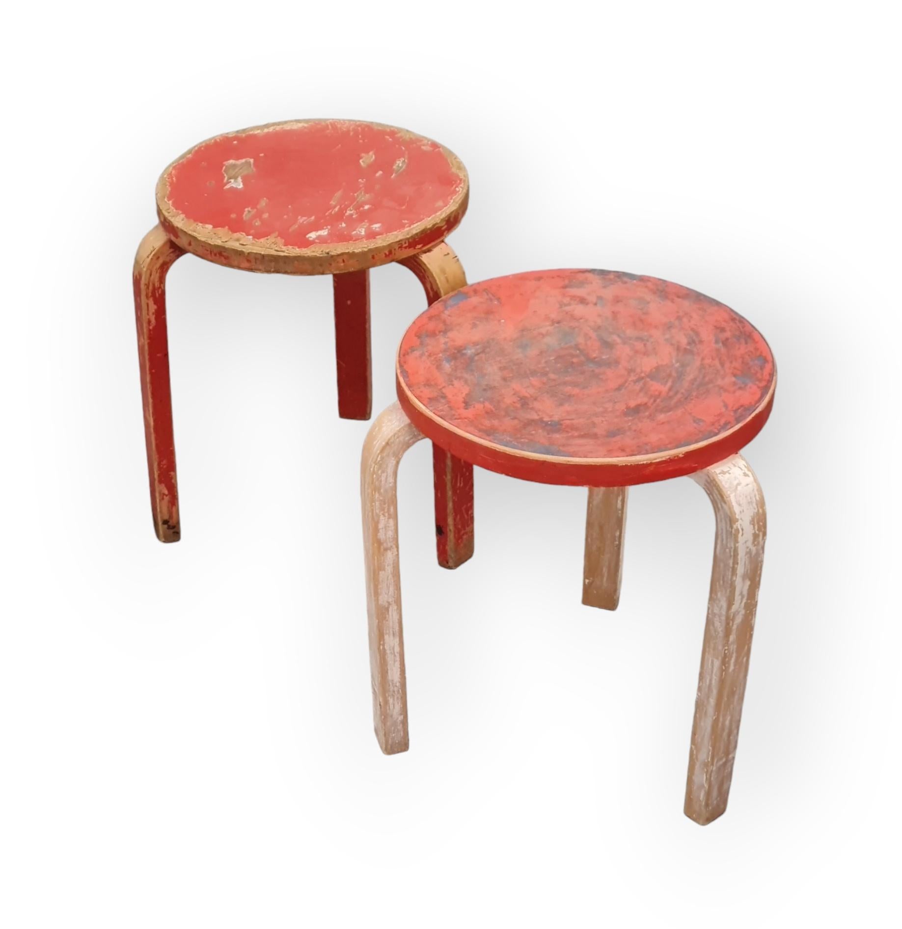 A pair of Artek stools in birch and muliti layered colourful beautiful patina, designed by Alvar Aalto and retailed by Artek in the 1950s. The model 60 stool is perhaps the most well known Aalto design and has always been attractive to people. As