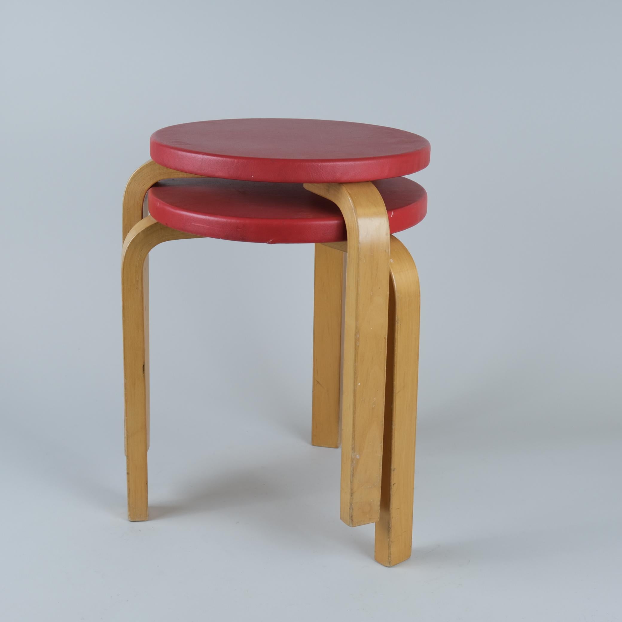 These two iconic Alvar Aalto stools from the 1950s are beautiful and space saving furniture pieces of timeless design. The legs are mounted directly to the underside of the round seat without the need for complicated connecting elements. The stools