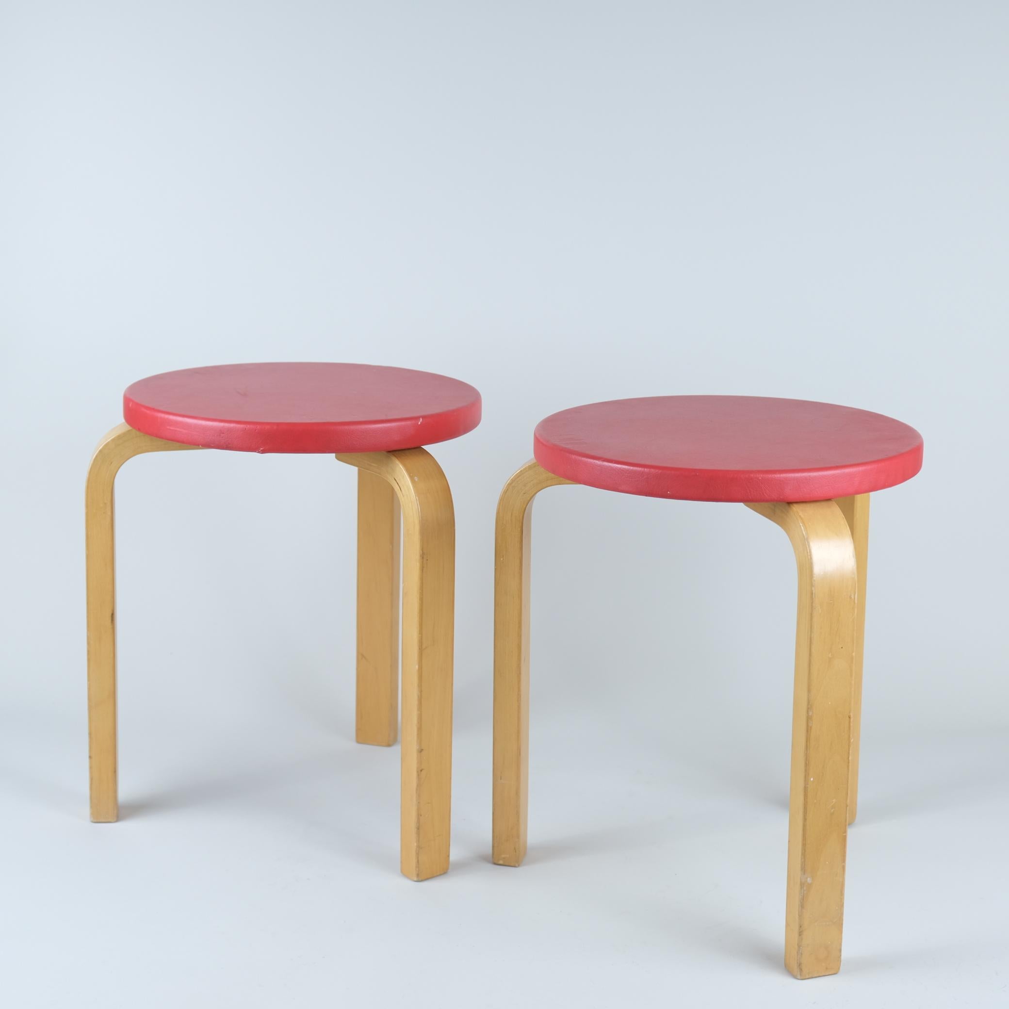 Mid-Century Modern A Pair of Alvar Aalto Stools Model 60, Red Pegamoid Upholstery, Artek 1950s For Sale