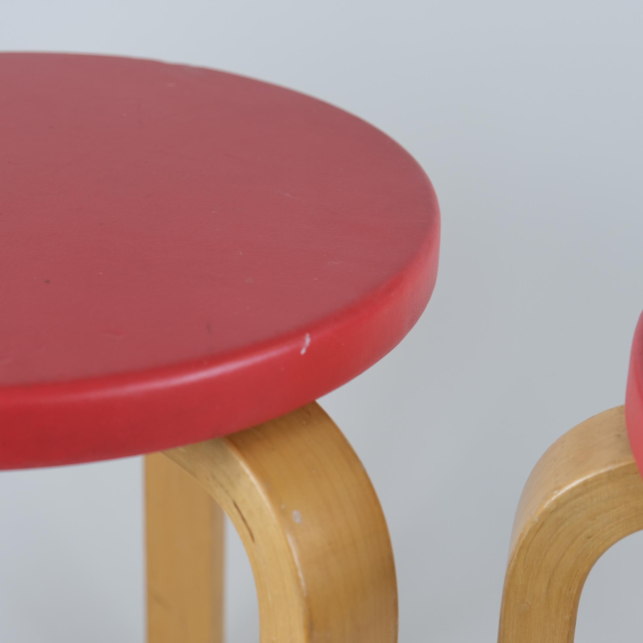 Mid-20th Century A Pair of Alvar Aalto Stools Model 60, Red Pegamoid Upholstery, Artek 1950s For Sale