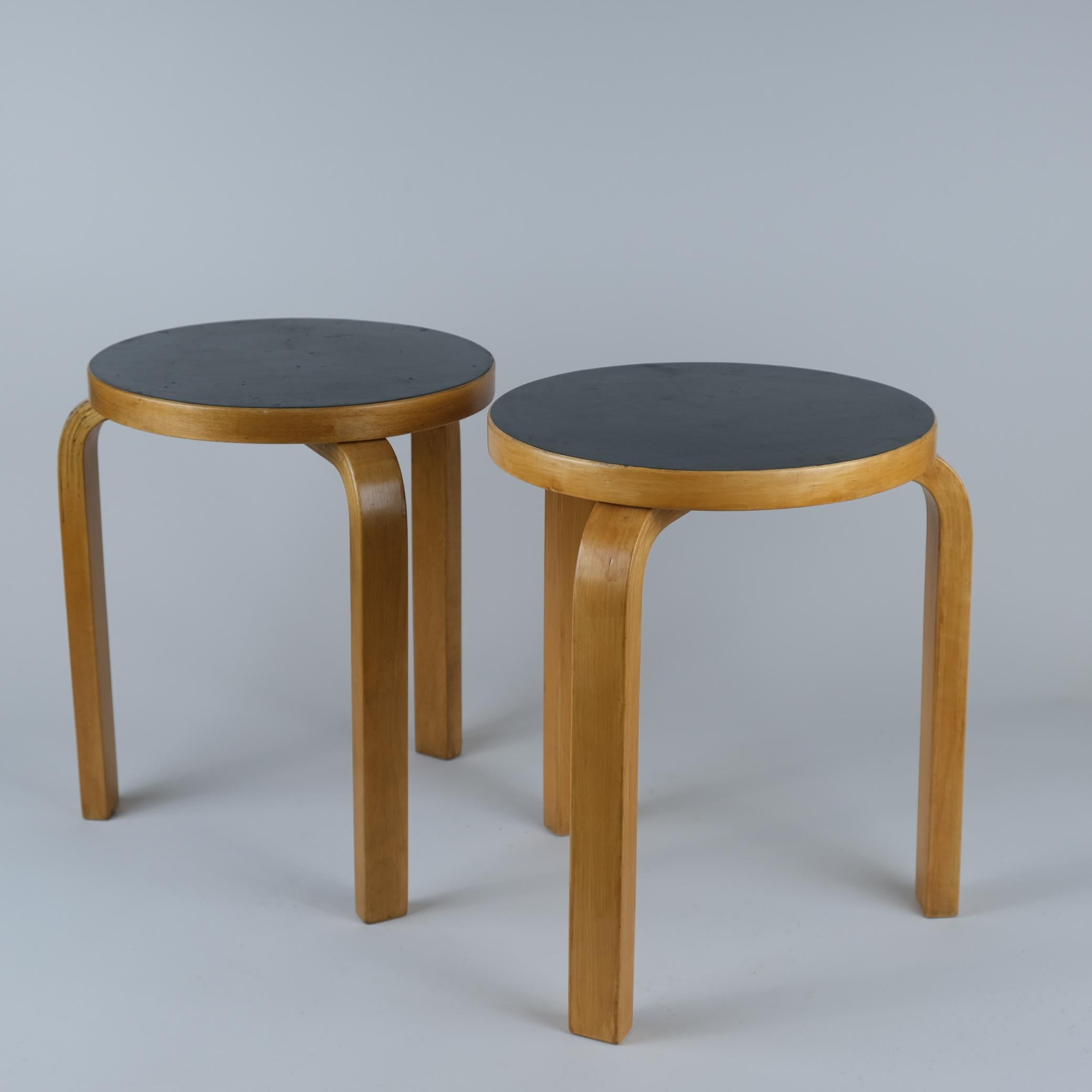 These two iconic Alvar Aalto stools from the 1950s are beautiful and space saving furniture pieces of timeless design. The legs are mounted directly to the underside of the round seat without the need for complicated connecting elements. The stools