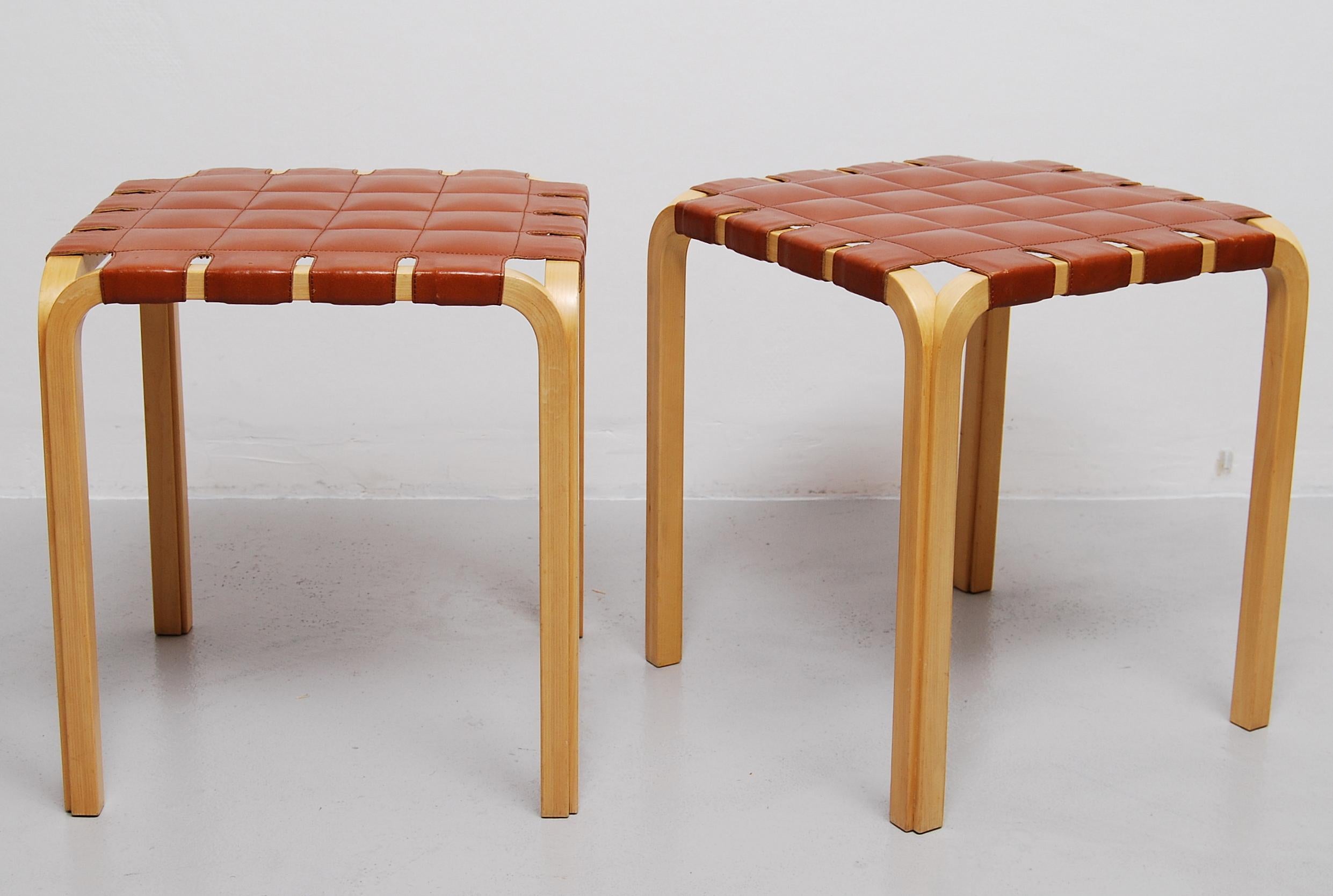 Designed in 1947, Alvar Aalto's Y61 stool required a special technique to create the unique birch Y-legs. This pair with original leather seats are in a wonderful condition.
Manufactured by Artek.
 