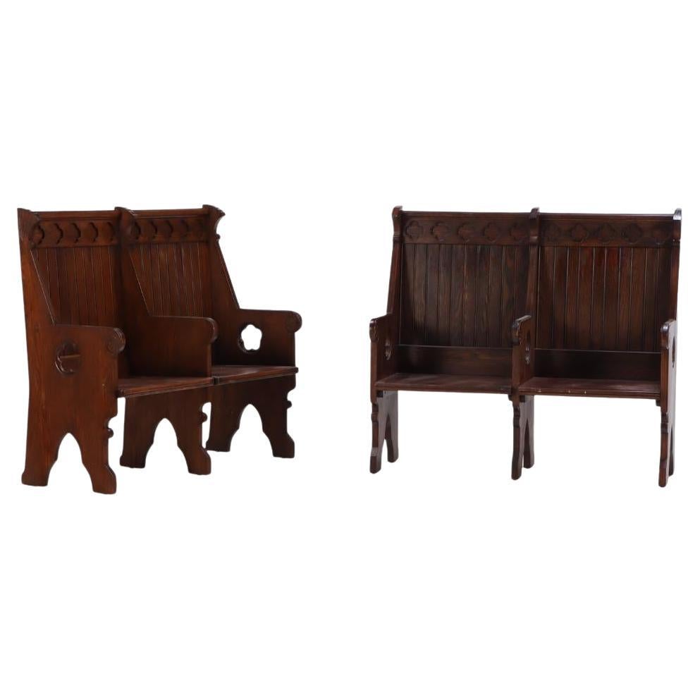A Pair of American Gothic style carved oak double benches, C 1900.