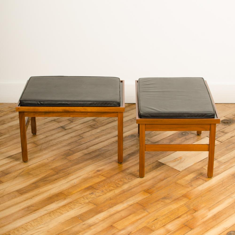 Pair of  American of Martinsville small benches, with original leather seats, American, 1950s. Leather cushions have original labels.
   