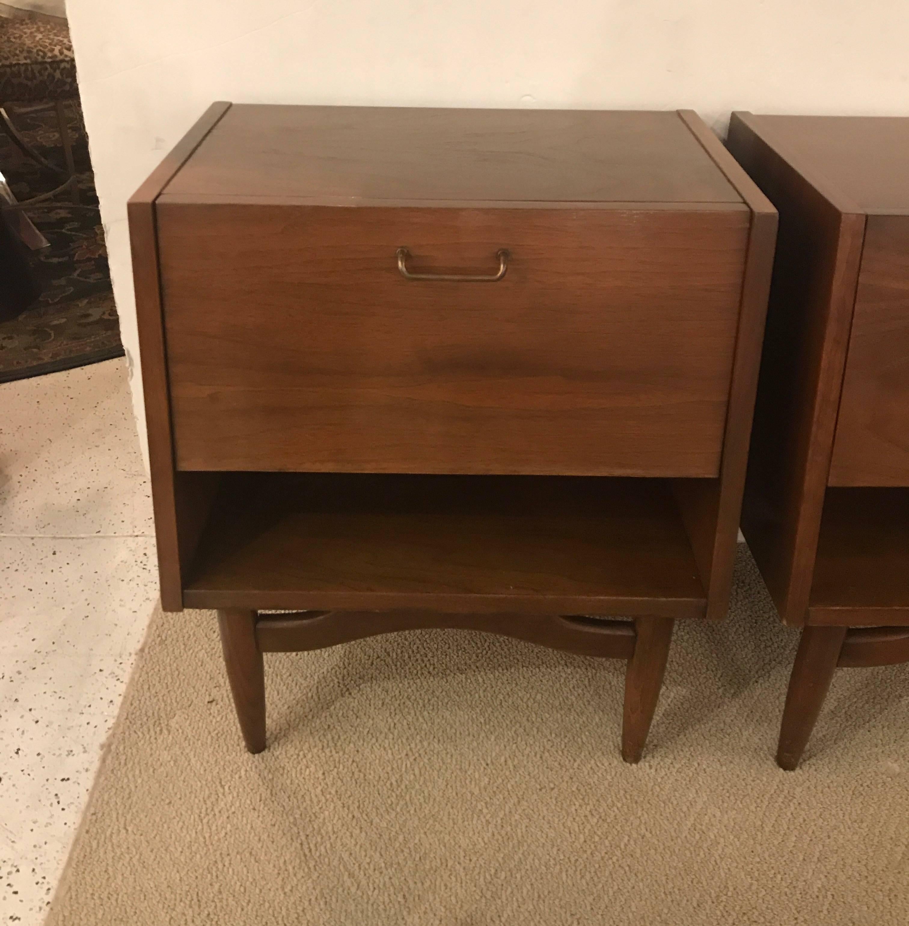 Pair of Merton Gershun nightstands for American of Martinsville.
This vintage pair of wooden nightstands, designed by Merton Gershun for the American of Martinsville 'Dania Collection', produced circa 1950s-1960s, comes with laminated sides and