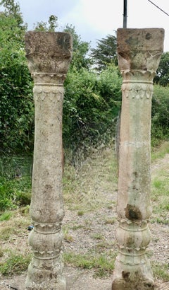 A Pair of Ancient Corinthian Type Stone Columns