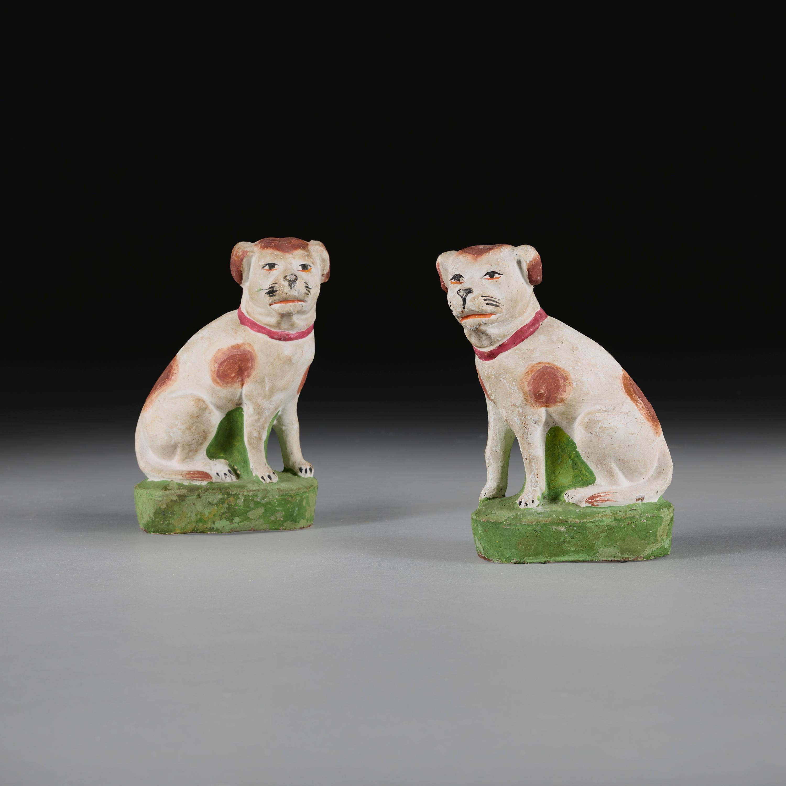 Anglo-Chinese, circa 1890

A pair of late nineteenth century painted terracotta spaniels, each dog with brown spots and red collar sat amongst a grassy mound.

Height 21.500cm

Width 14.50cm

Depth 9.00cm