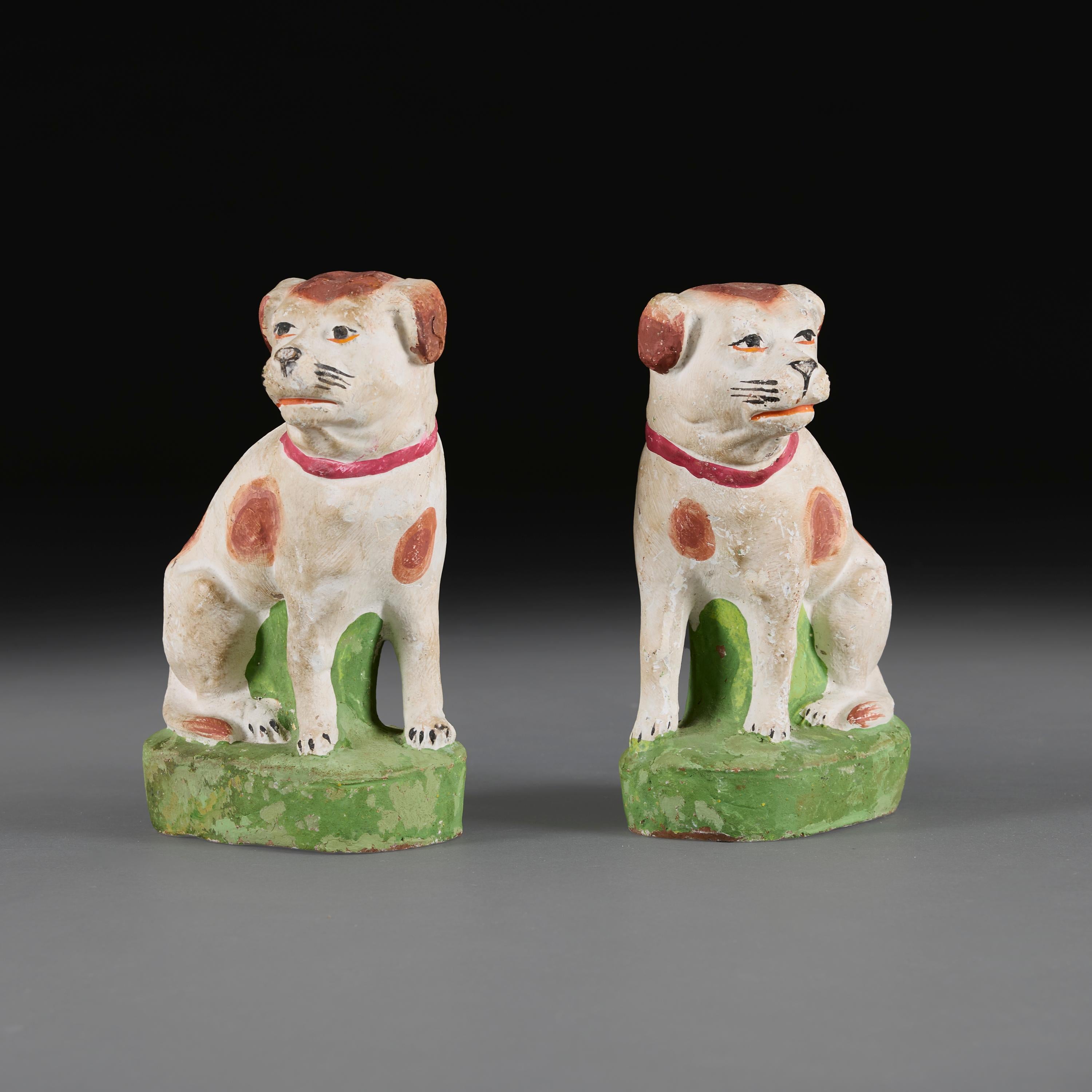 A Pair of Anglo-Chinese Painted Terracotta Recumbent Spaniels In Good Condition For Sale In London, GB