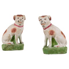 A Pair of Anglo-Chinese Painted Terracotta Recumbent Spaniels