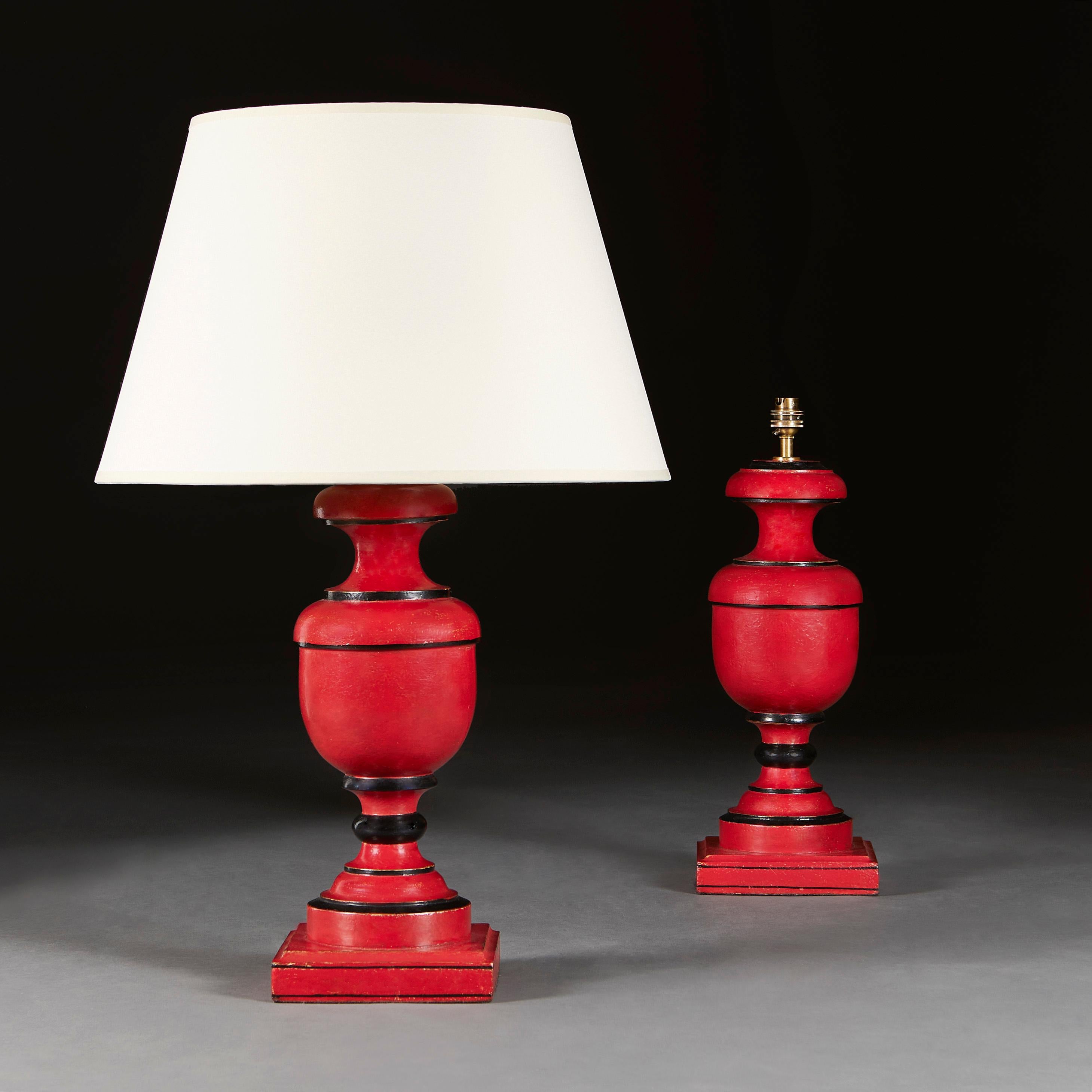 India, circa 1940

A pair of Anglo Indian baluster wood table lamps, with red paintwork with gold flecks and punctuated with black concentric bands.

Measures: Height of lamp 41.00cm
Height with shade 70.00cm
Width of base 17.00cm.

Please note: