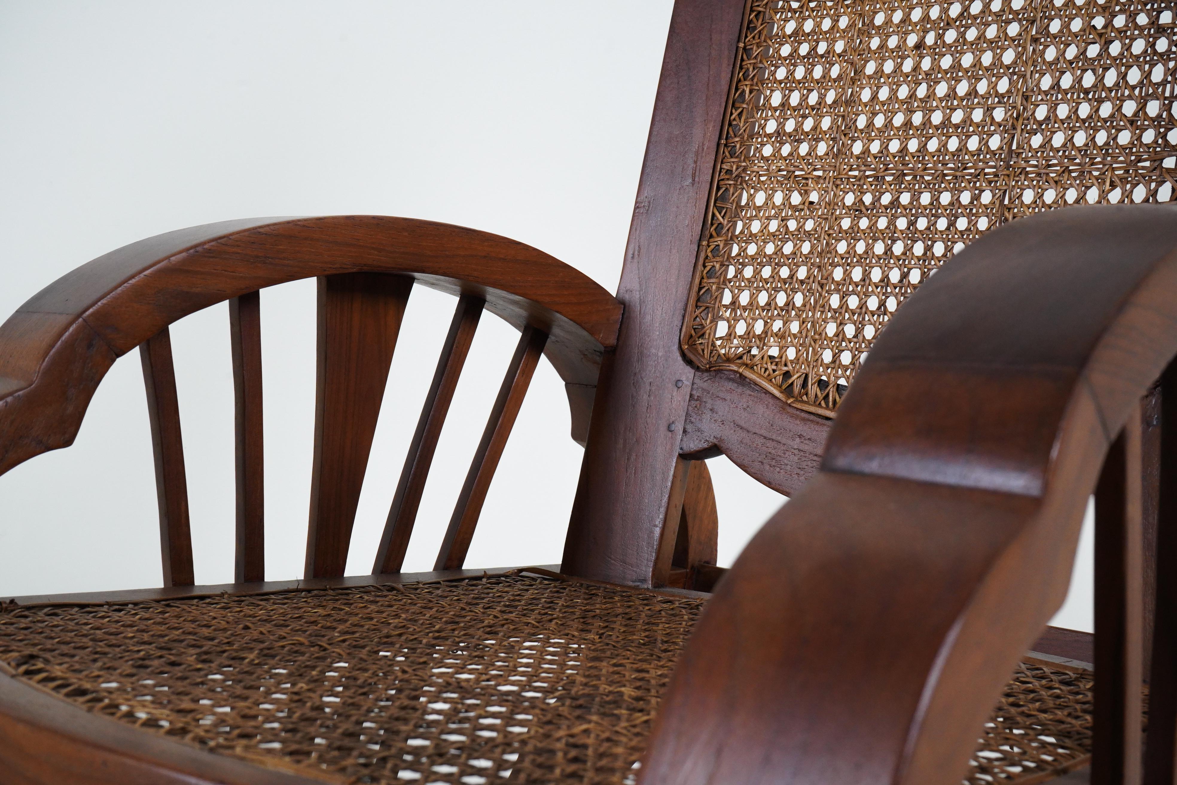 British Colonial A Pair of Vintage Anglo-Indian Veranda Chairs in Teak and Rattan For Sale