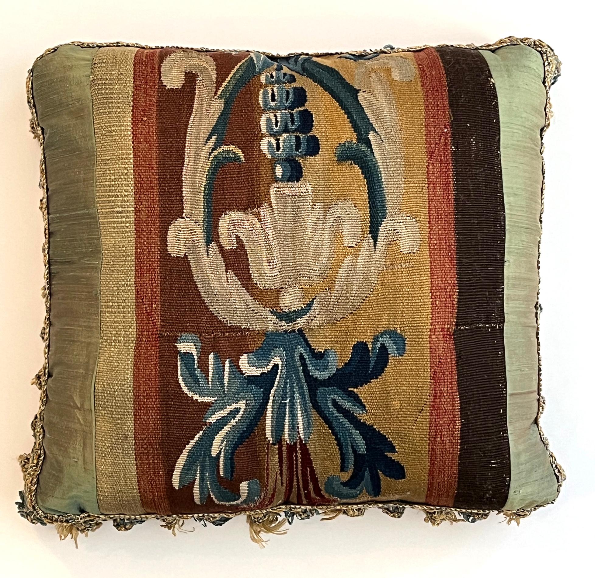 Each square pillow with tapestry insert with silk borders and back; with tassels to edges.