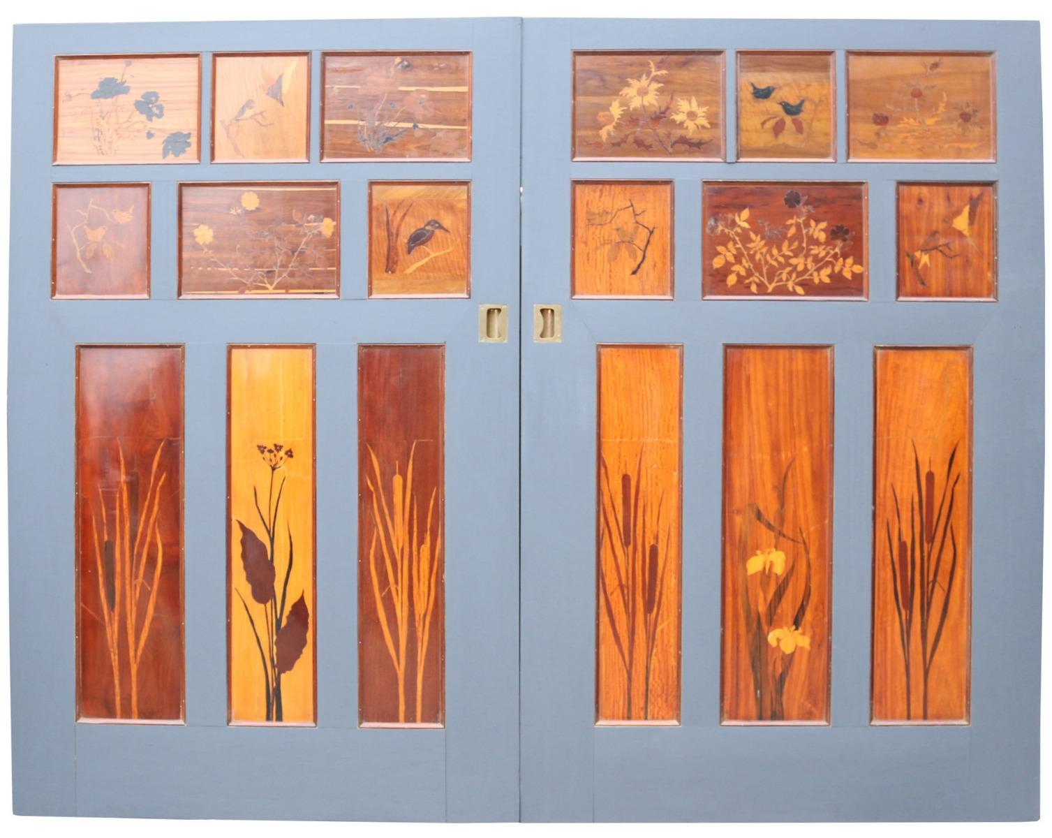 These stunning doors feature intricate inlaid marquetry panels depicting scenes of British flora and fauna. These were salvaged from a large house in Bedford. These doors were originally fitted to a sliding track.