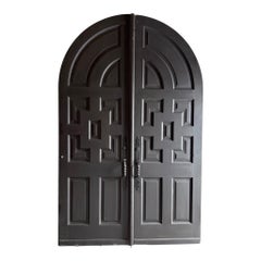 A Pair of Antique Arched Paneled Mahogany Church Doors
