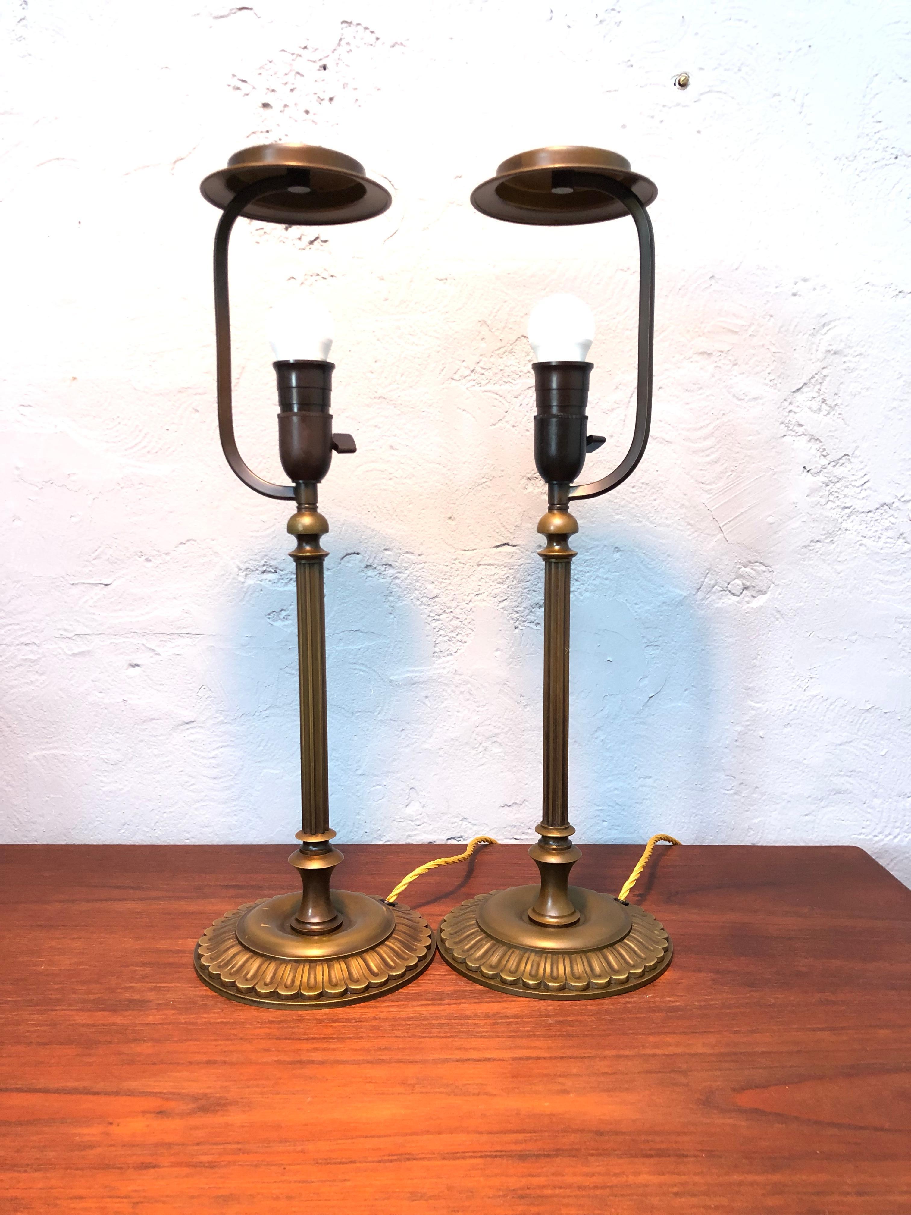 An antique matching pair of Danish brass table lamps from the 1920s.
In original condition with lovely patina and color to the brass. 
Still maintaining their original brass shade holders. 
Great quality and craftsmanship.
The lamps have been
