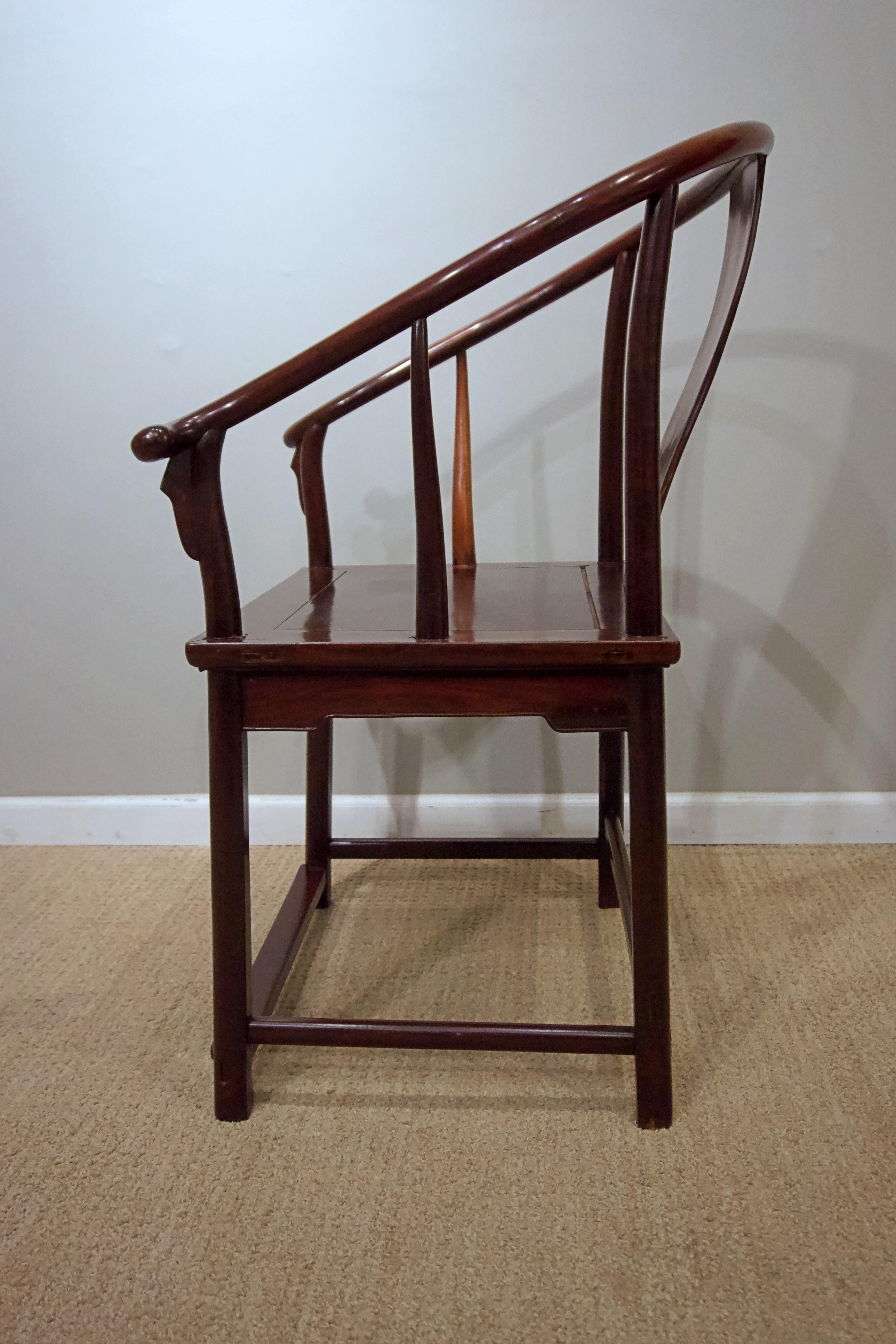 Polished Pair of Antique Chinese Rosewood Horseshoe Back Armchairs