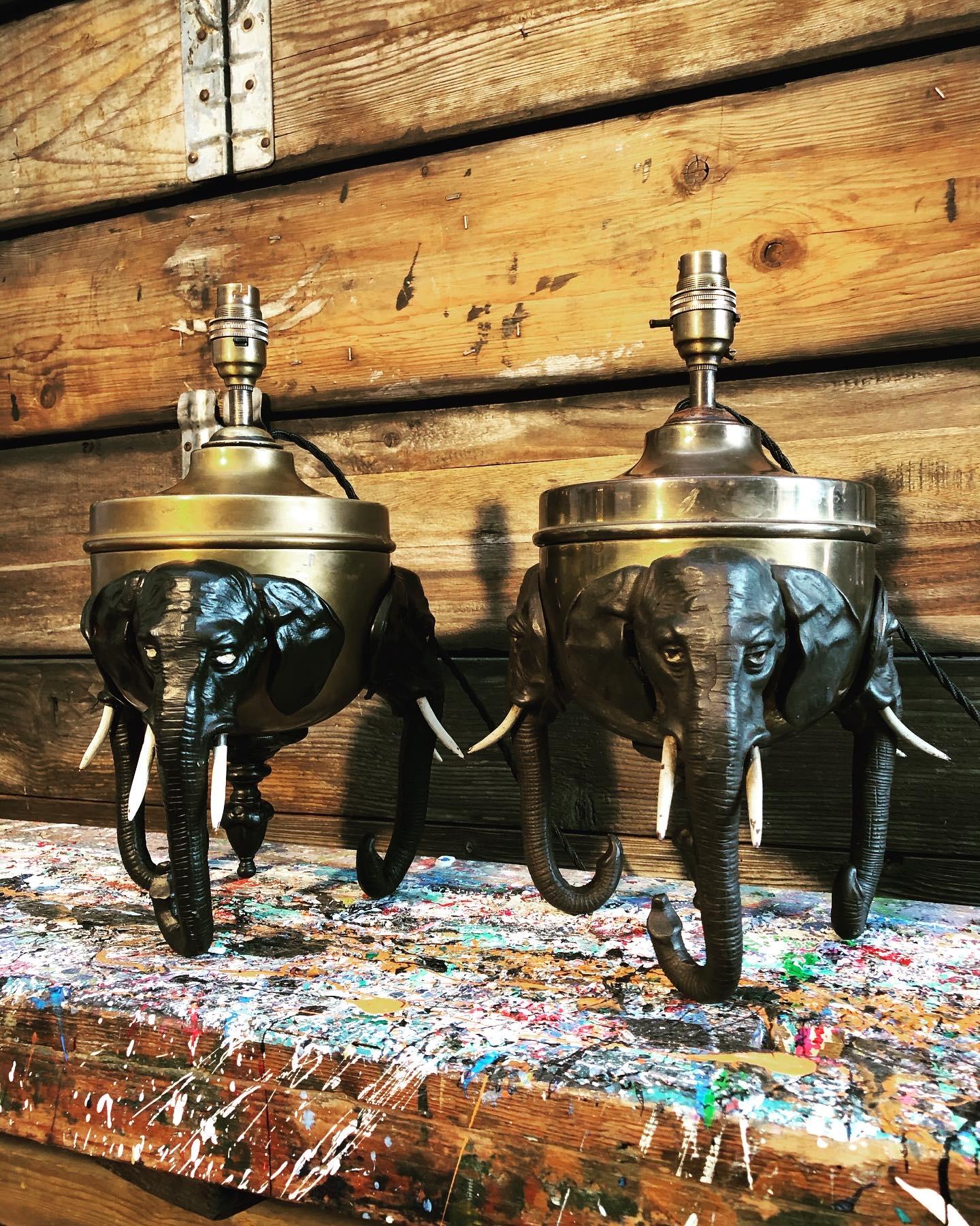 A pair of rare antique elephant lamps from the late 19th century.
Raised on 3 elephant heads.
Original cold painted bronze with a great patina and look to the surface.
Converted and electrified with brass B22 lamp holders black twisted cloth flex