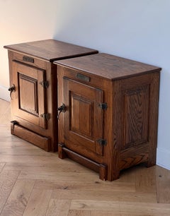 A pair of antique craftsman nightstands in oak, circa 1900