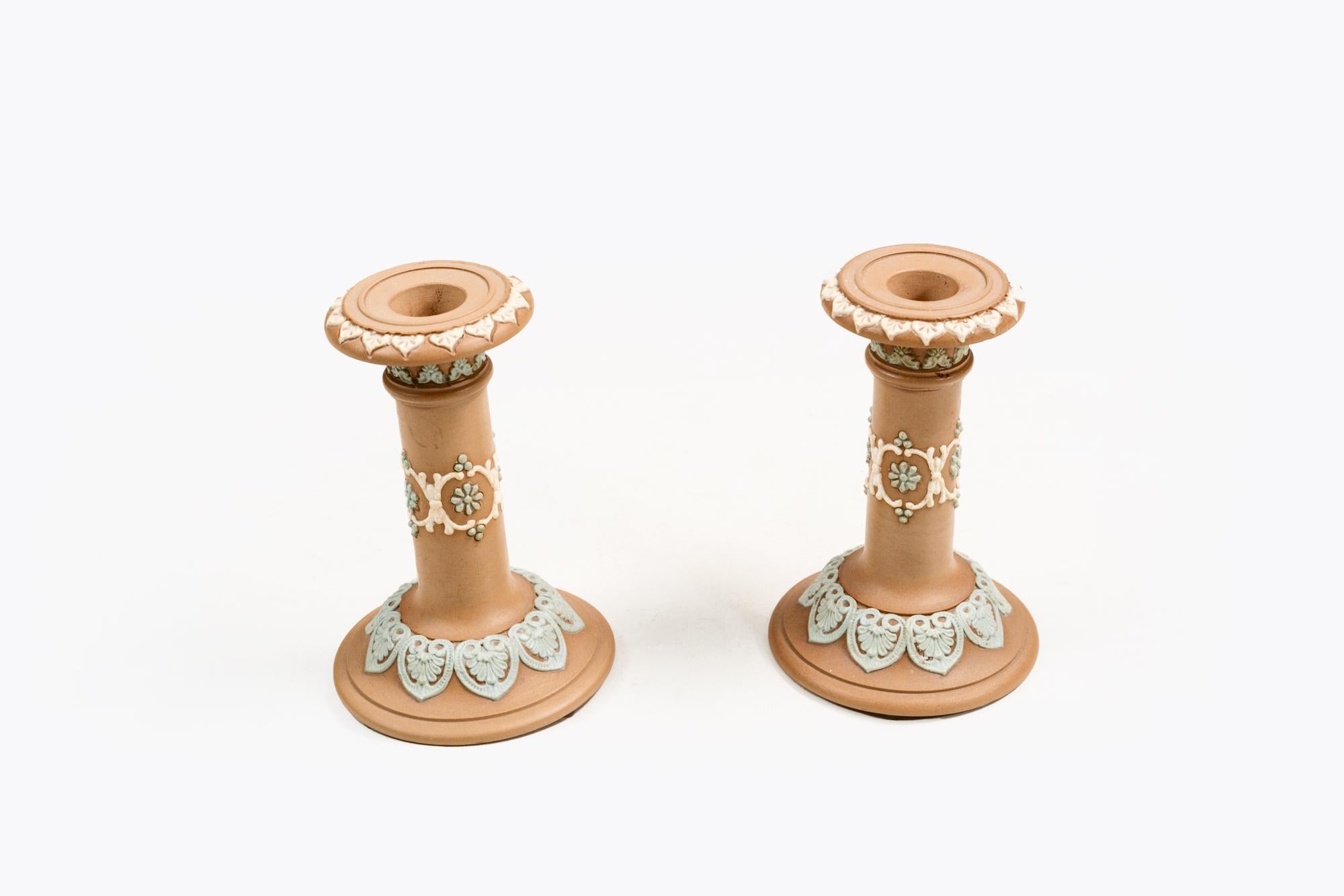 A pair of antique Doulton candlesticks made in Silicon Ware from the Lambeth factory, dating from the turn of the last century, 1881-1912  
