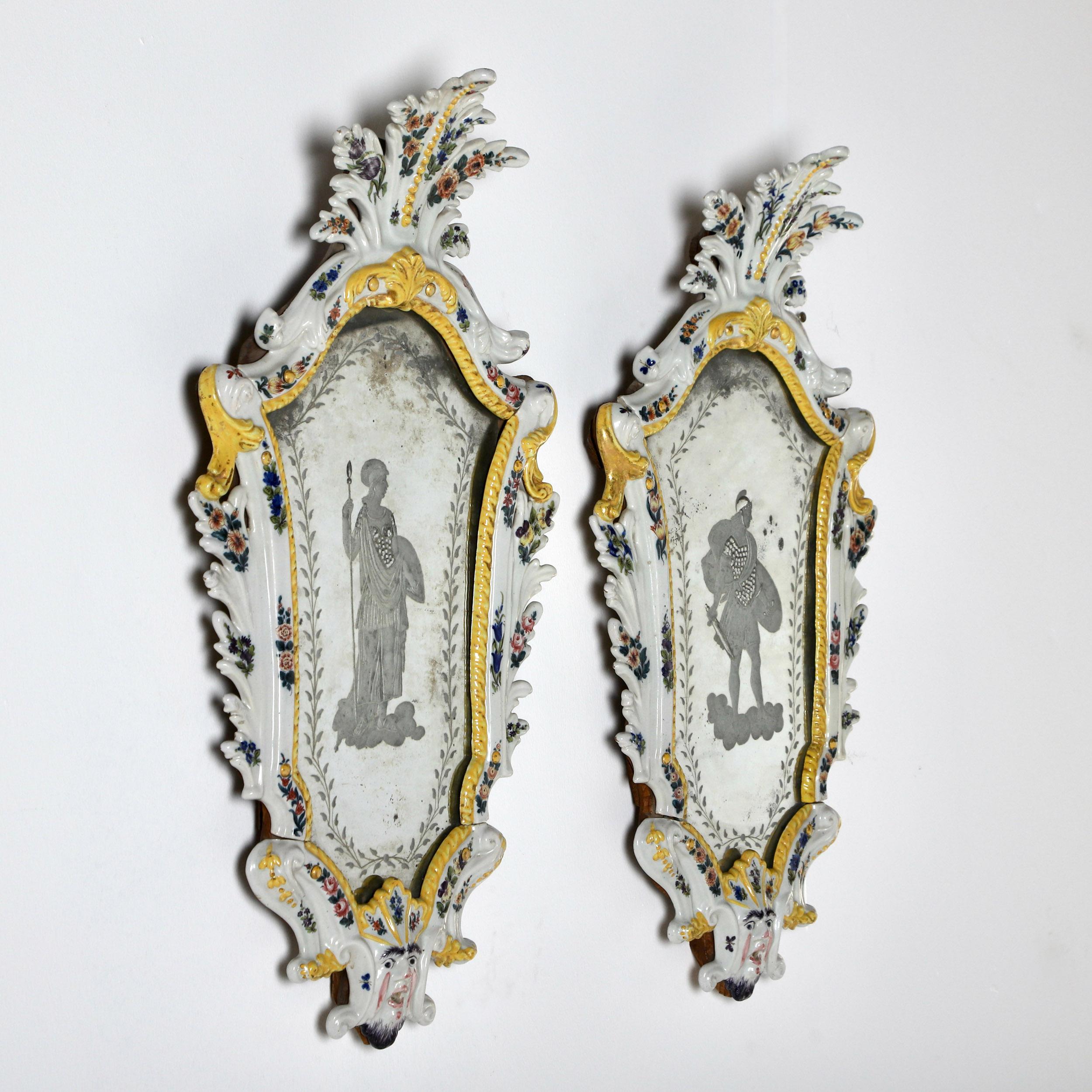 A wonderful pair of 19th century polychrome hand decorated maiolica mirror frames with inset venetian etched glass plates depicting Mars & Minerva 

For a similar pair of mirrors see Christies sale – 17185 – important Italian collection – lot 75