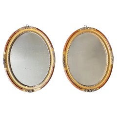 A Pair of Antique French Giltwood Oval Mirrors with Faux Tortoiseshell decoratio
