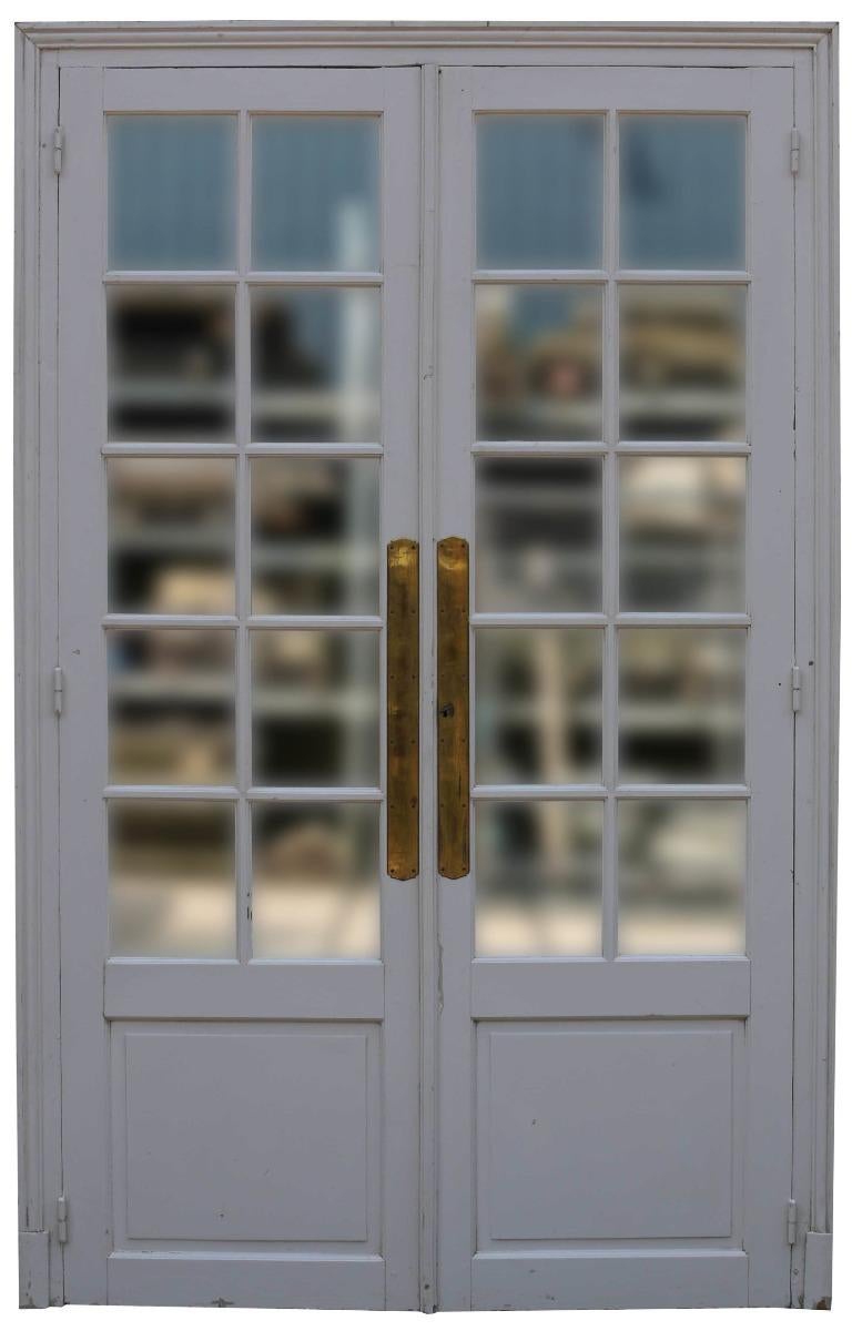 A very decorative pair of doors within a frame. Suitable for use as a cupboard front or room divider. Fitted with original glass. Painted finish.

Measures: Doors H 237.5 x W 139.5 x T 2.8 cm.