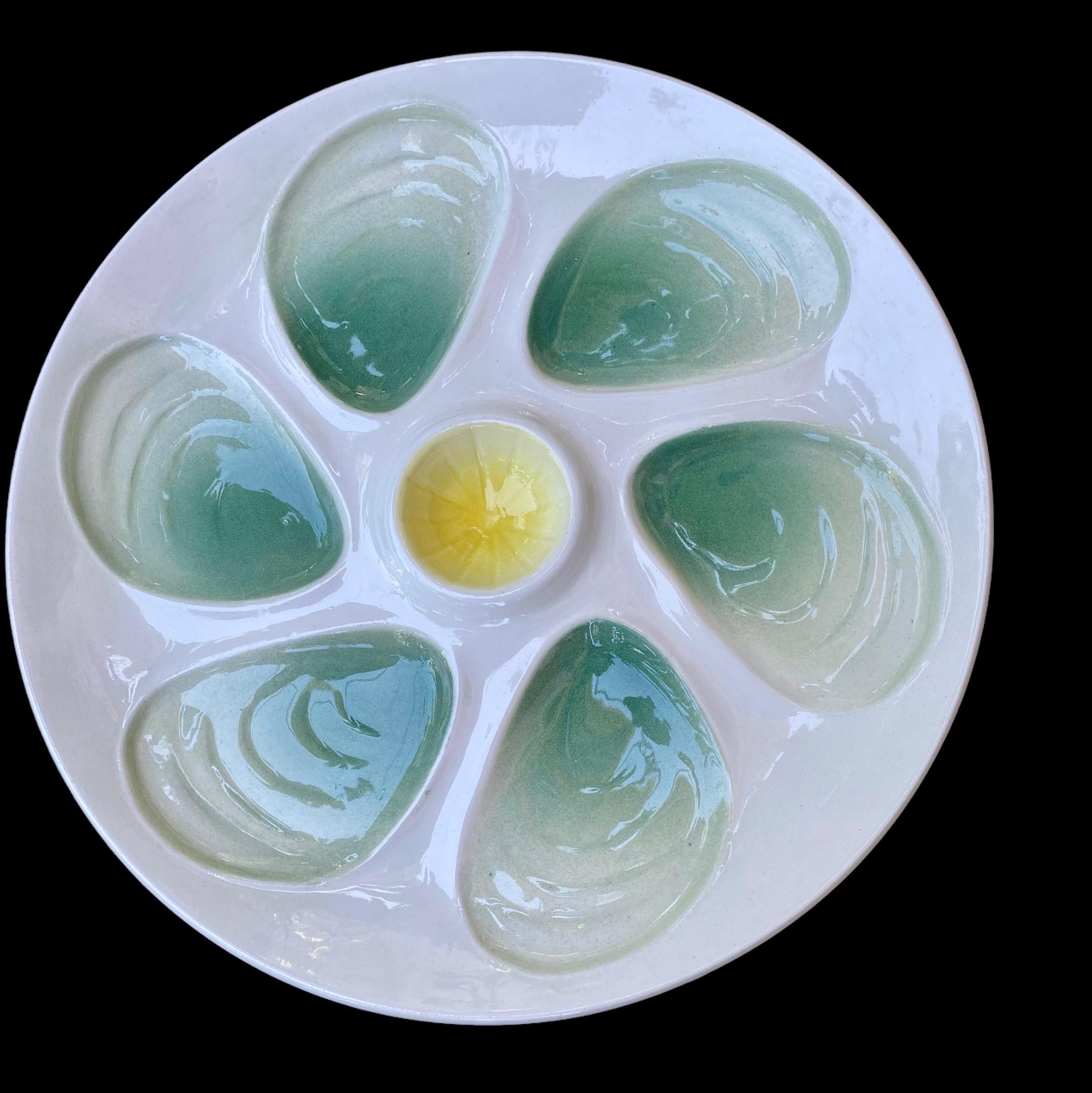 French Salins Seafoam Green Mid
Century Hand Painted Faience Majolica
Oyster Plates.
An oyster plate collectors 