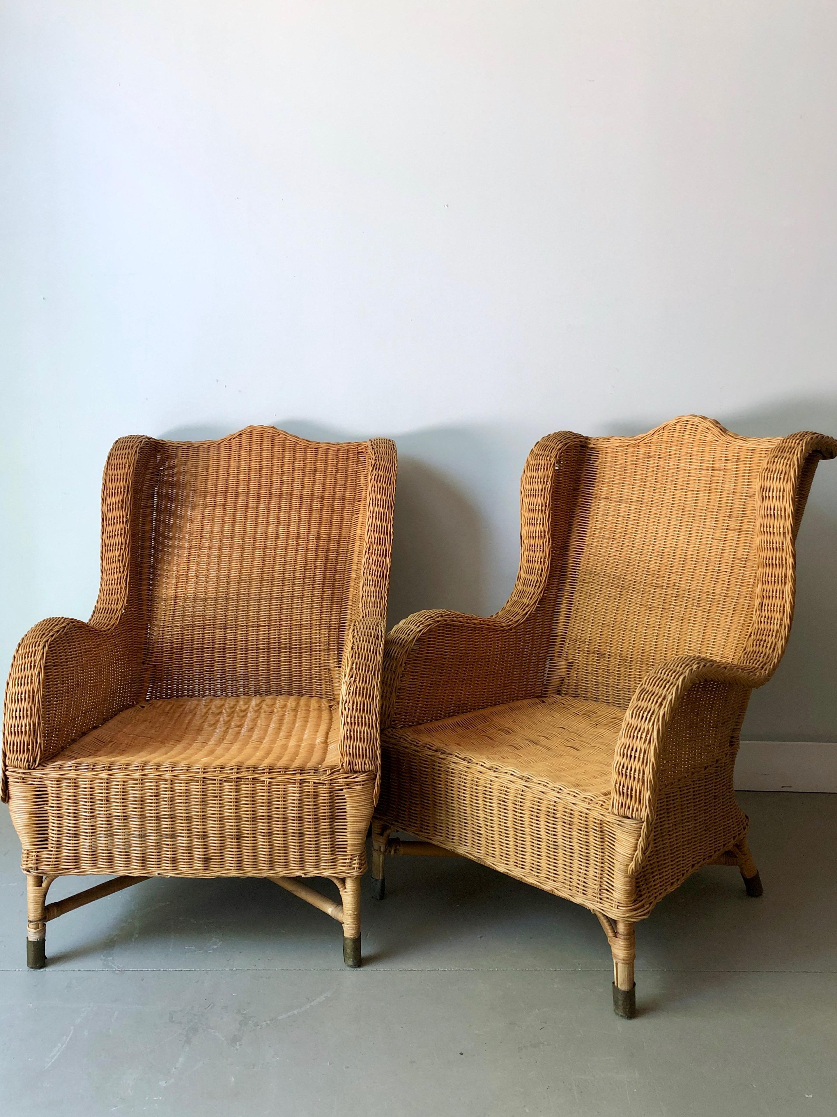A large pair of French rattan/wicker lounge chairs in style in 