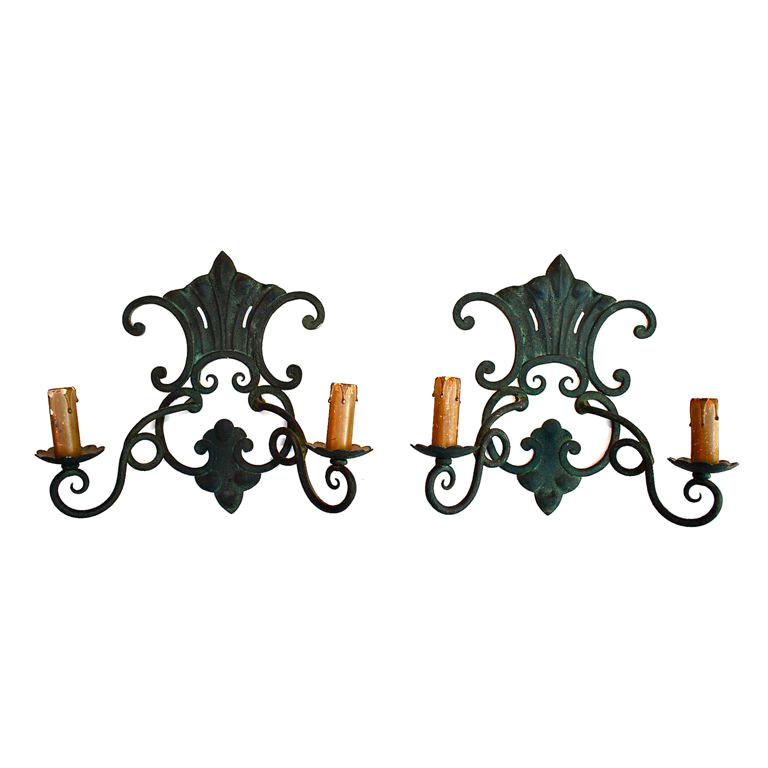 A pair of antique French wrought iron sconces