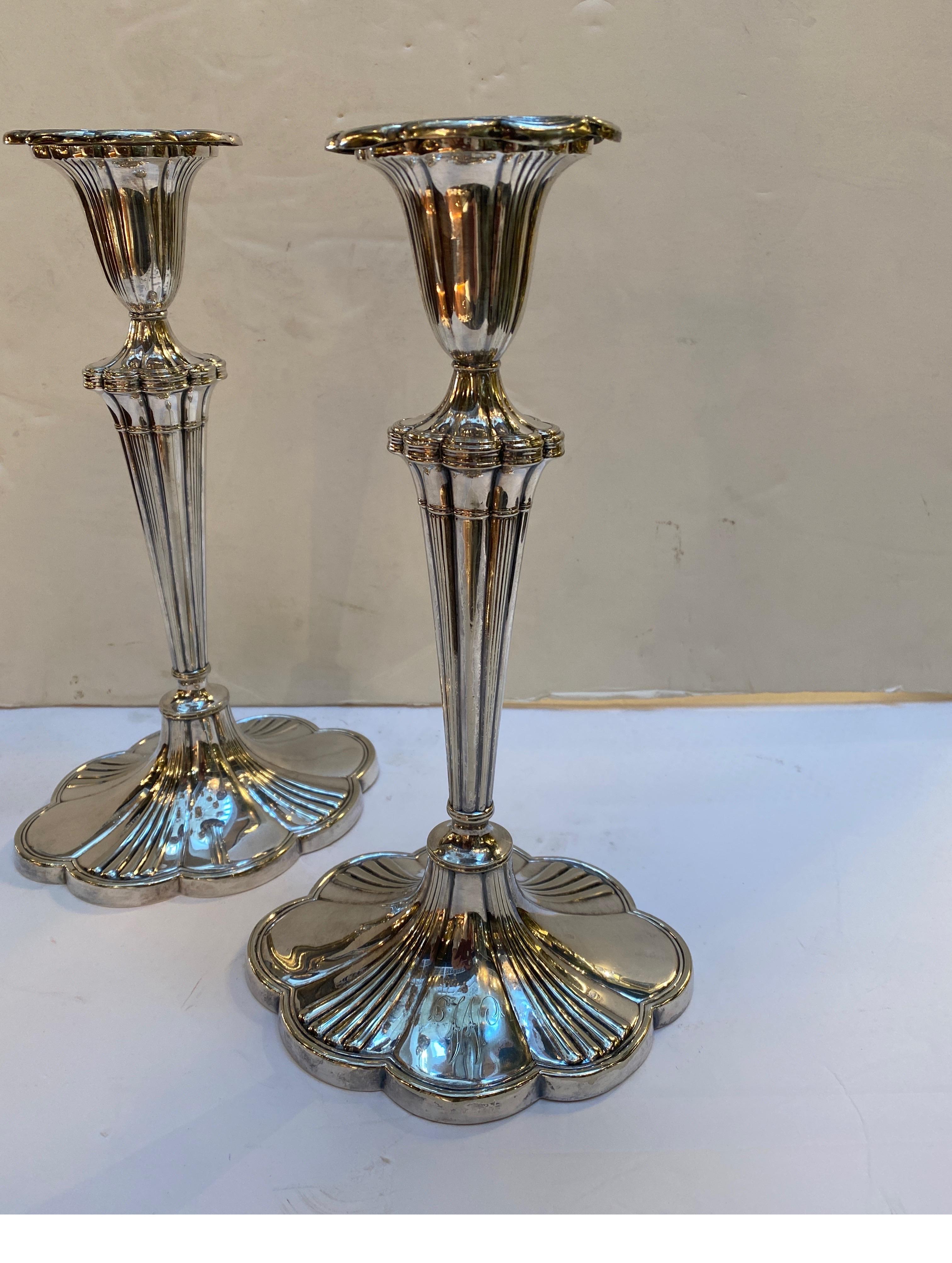 A Pair of elegant lobed candlesticks made by Gorham, year mark 1914. The graceful form with original bobech at the top with tapering ribbed center column with a scalloped base, light free hand engraved Initial W.  11 Inces Tall