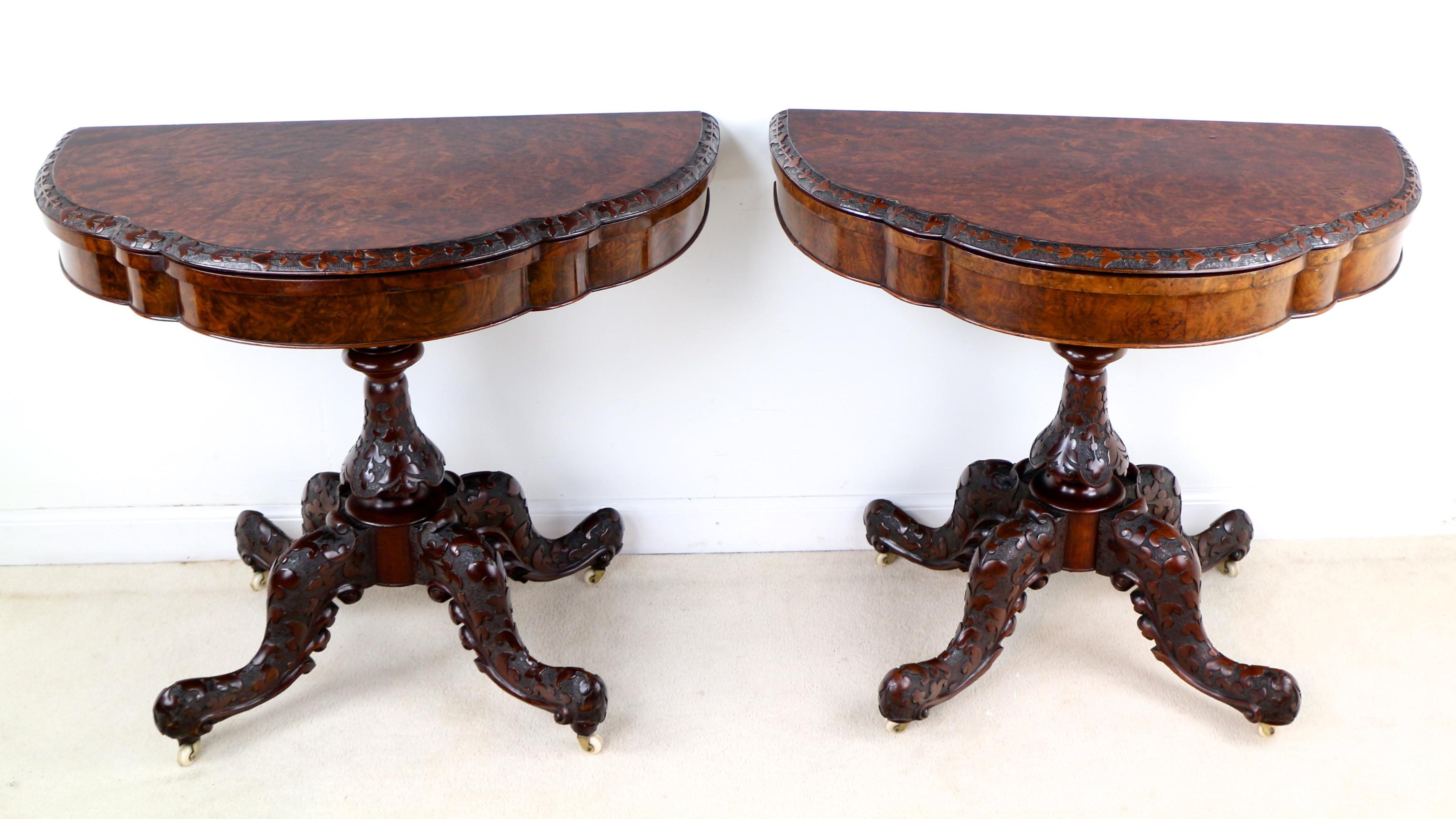 Stunning pair of 19th century Irish burr walnut cards tables, the serpentine shaped tops with highly figured bookmatched veneers and ‘Irish carved’ edge of trailing Shamrocks, leaves and bell flowers. Each standing on a turned and similarly